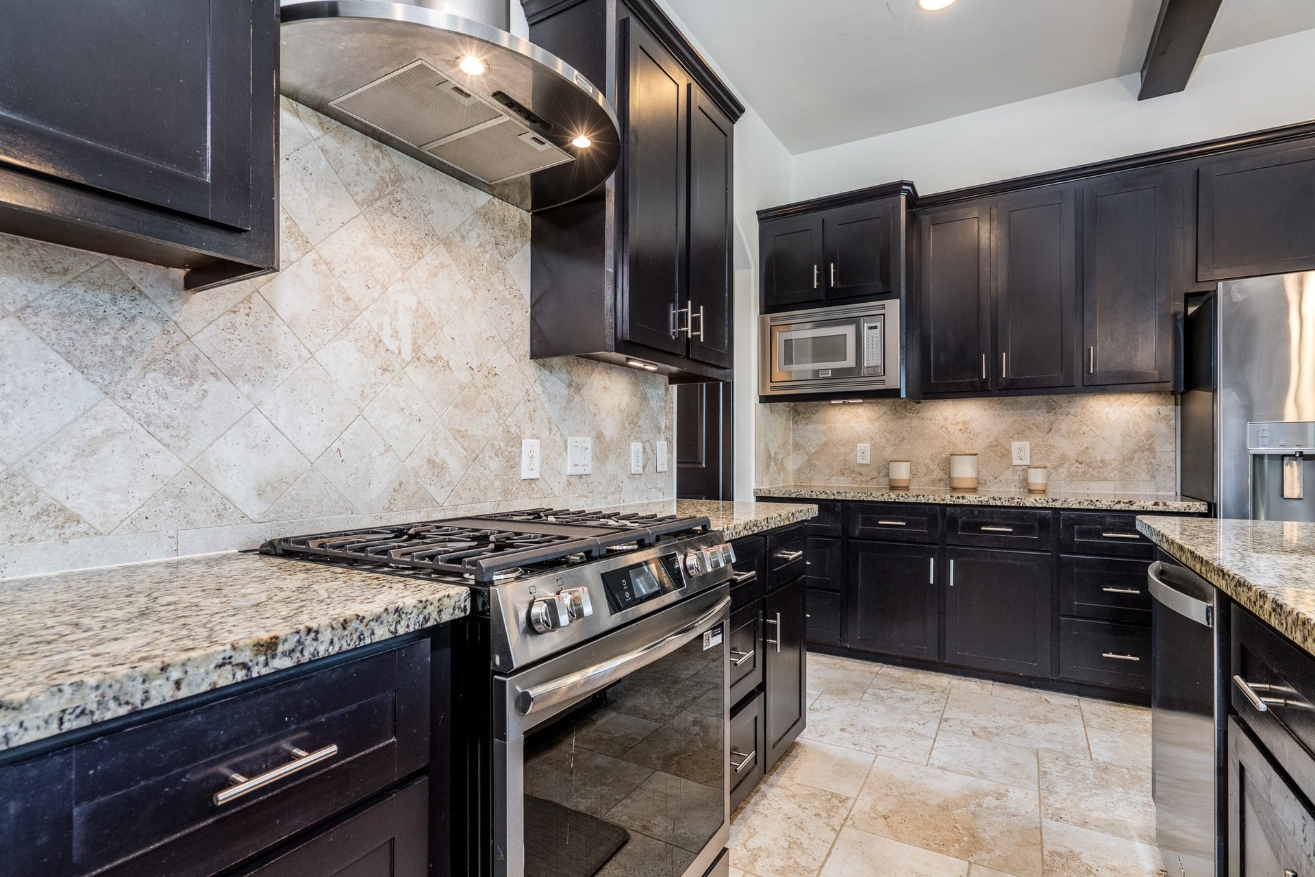 Chef-preferred gas cooking and nearby cavernous walk-in pantry.