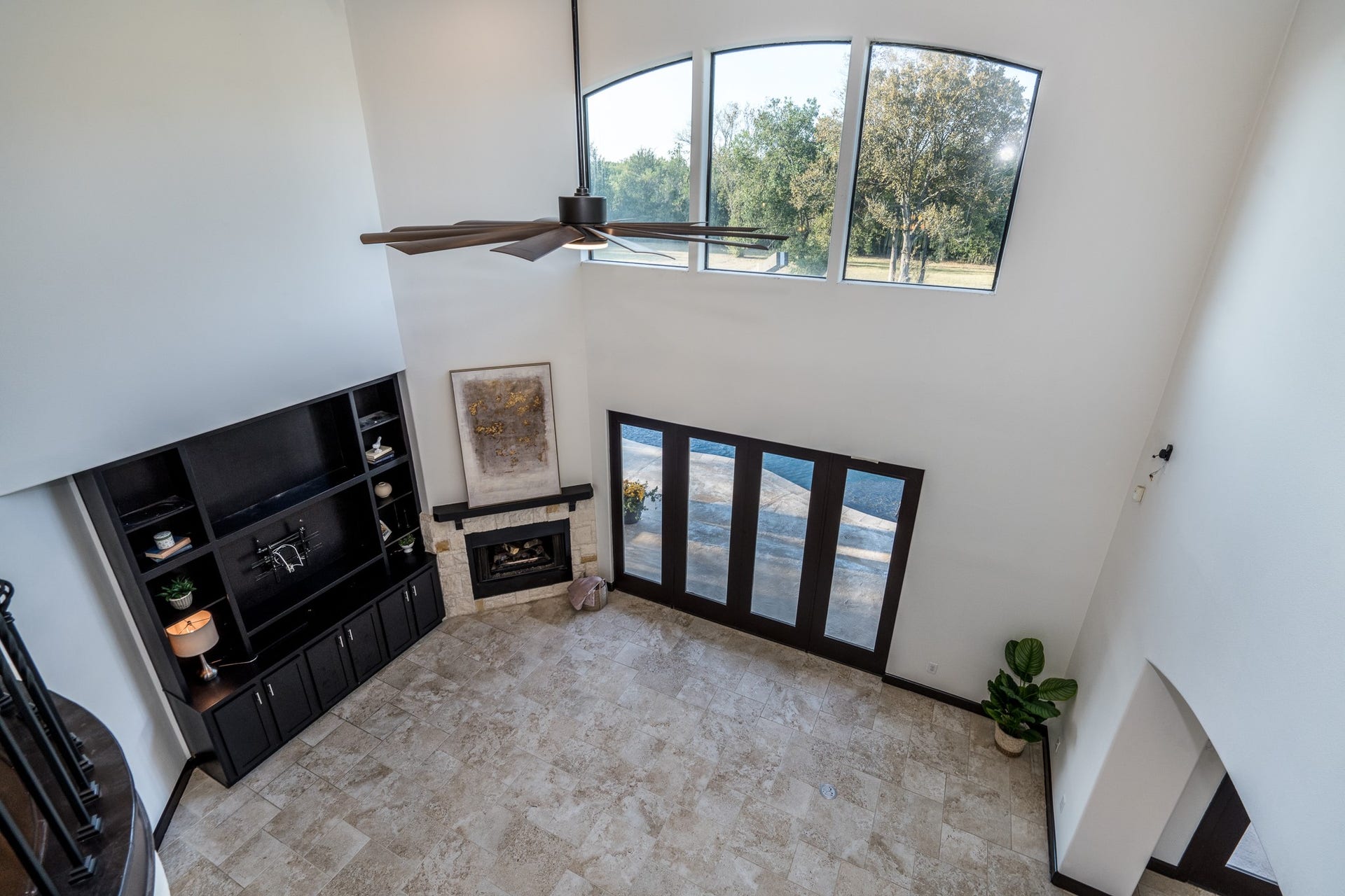 The lofty space has oversized ceramic tile flooring that continues into the breakfast and kitchen.