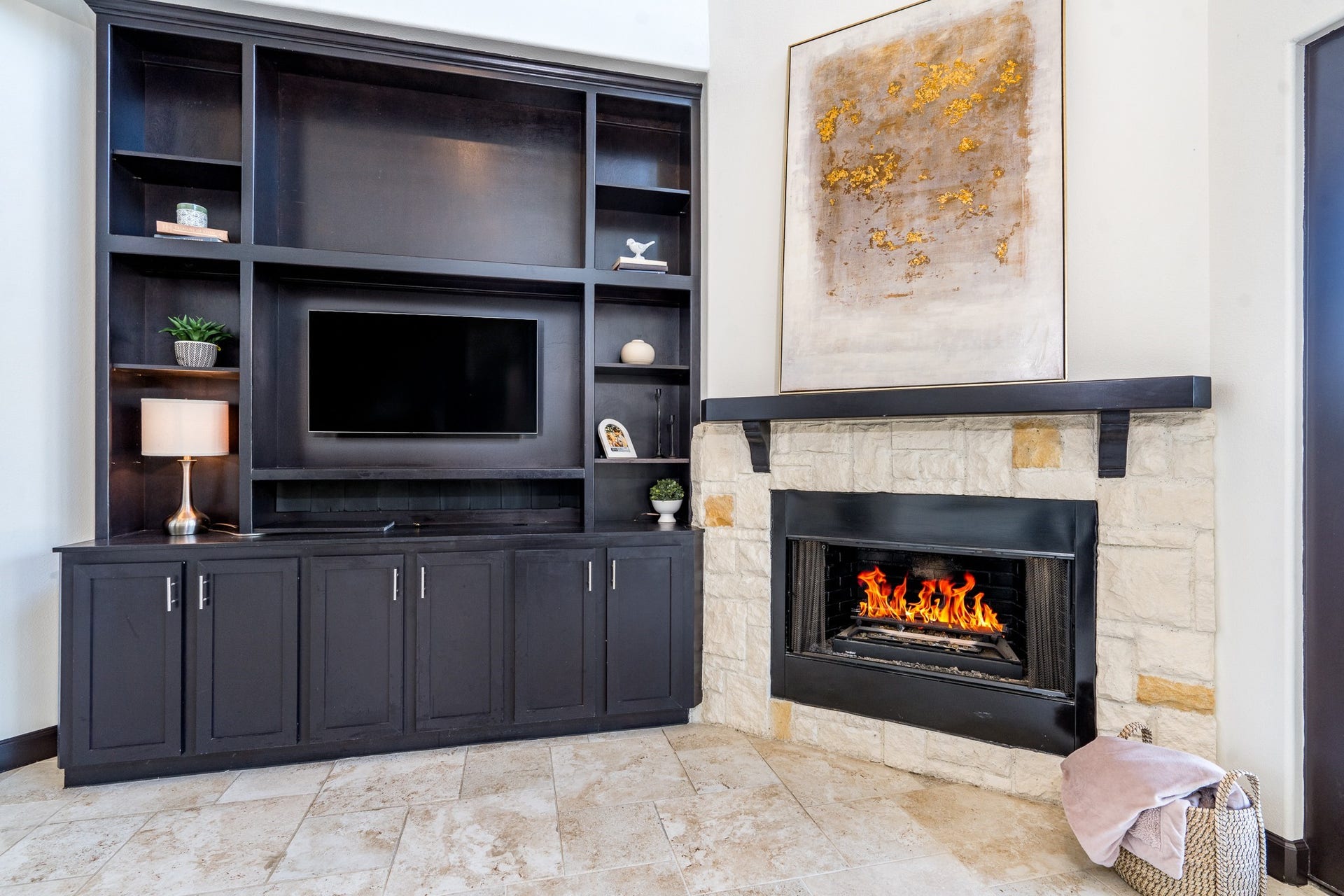 Wood custom built-in storage cabinet gives the perfect space for a flat screen that can be seen from the living, breakfast and kitchen.