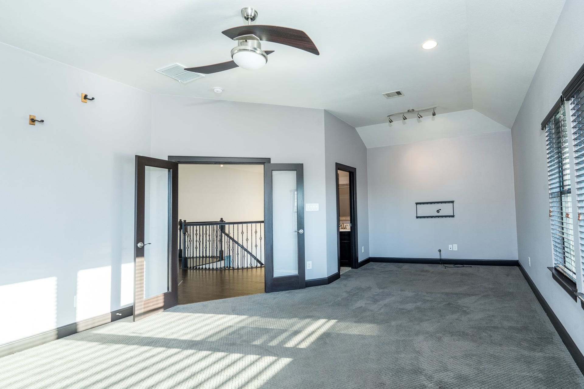 Game room or flex to a media room with French doors and its own half bath.