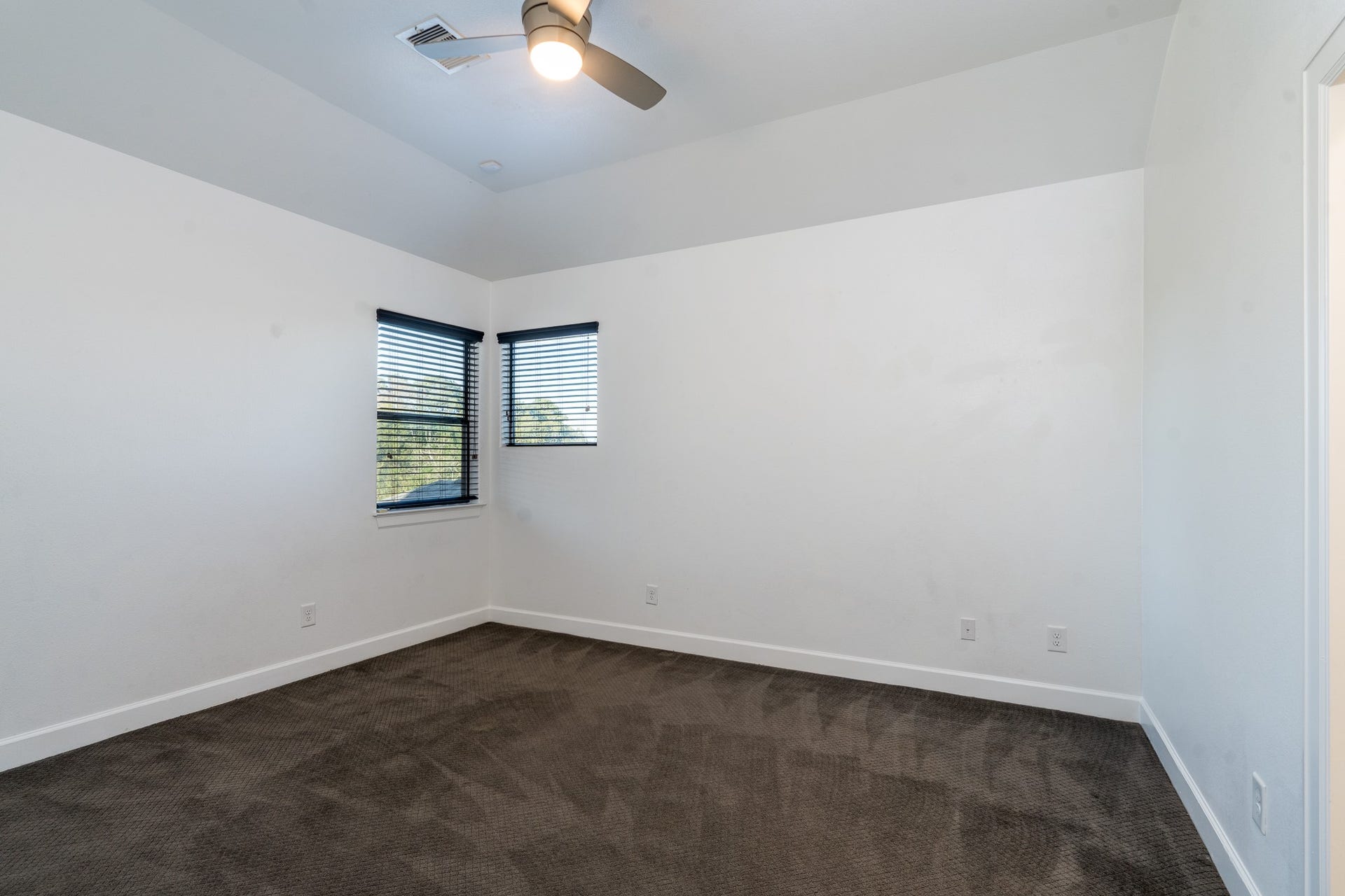First of two upstairs bedrooms. All carpet replaced 2023.