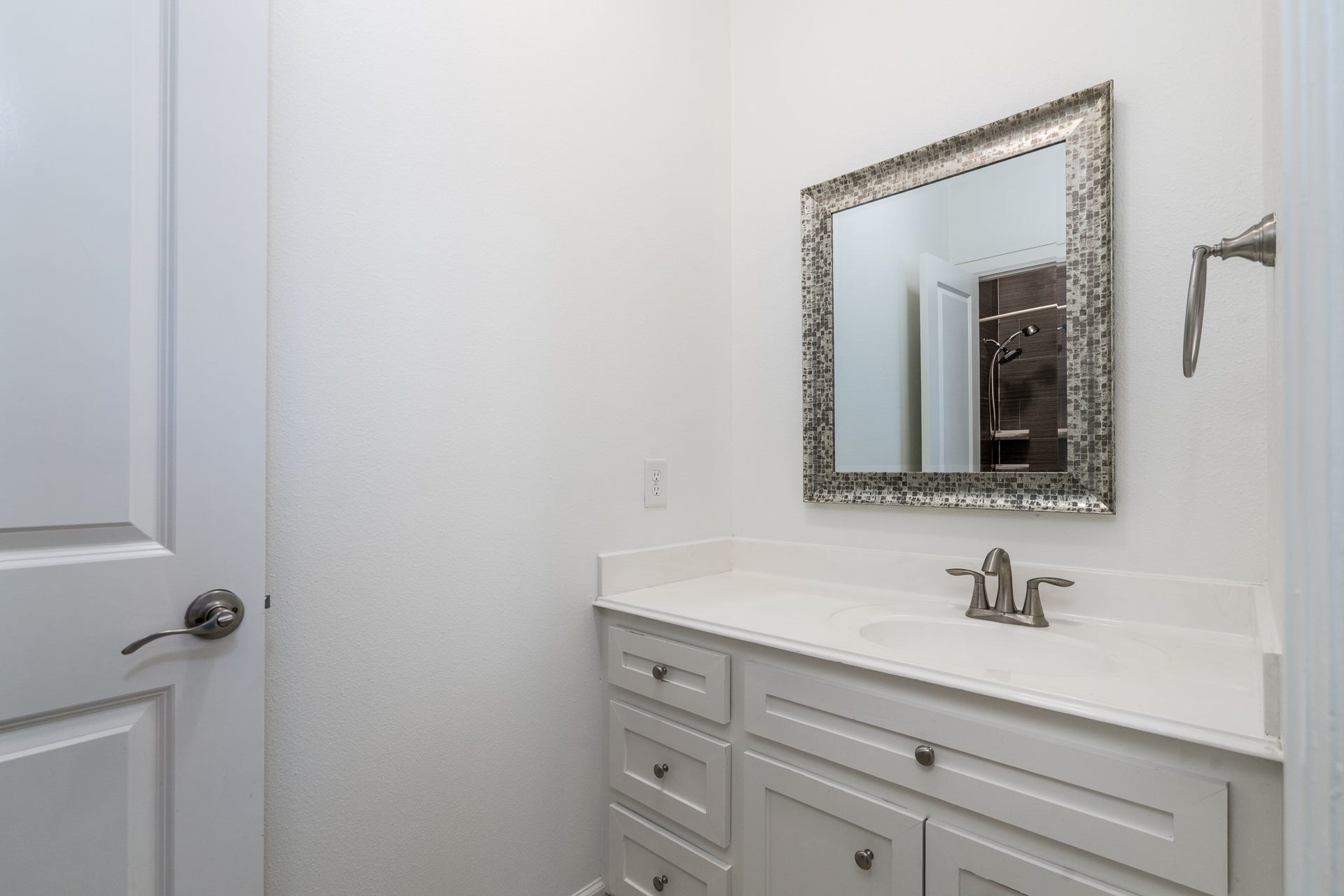 Jack and Jill bath where each bedroom gets their own counters. Recent paint here and in many areas of the home.