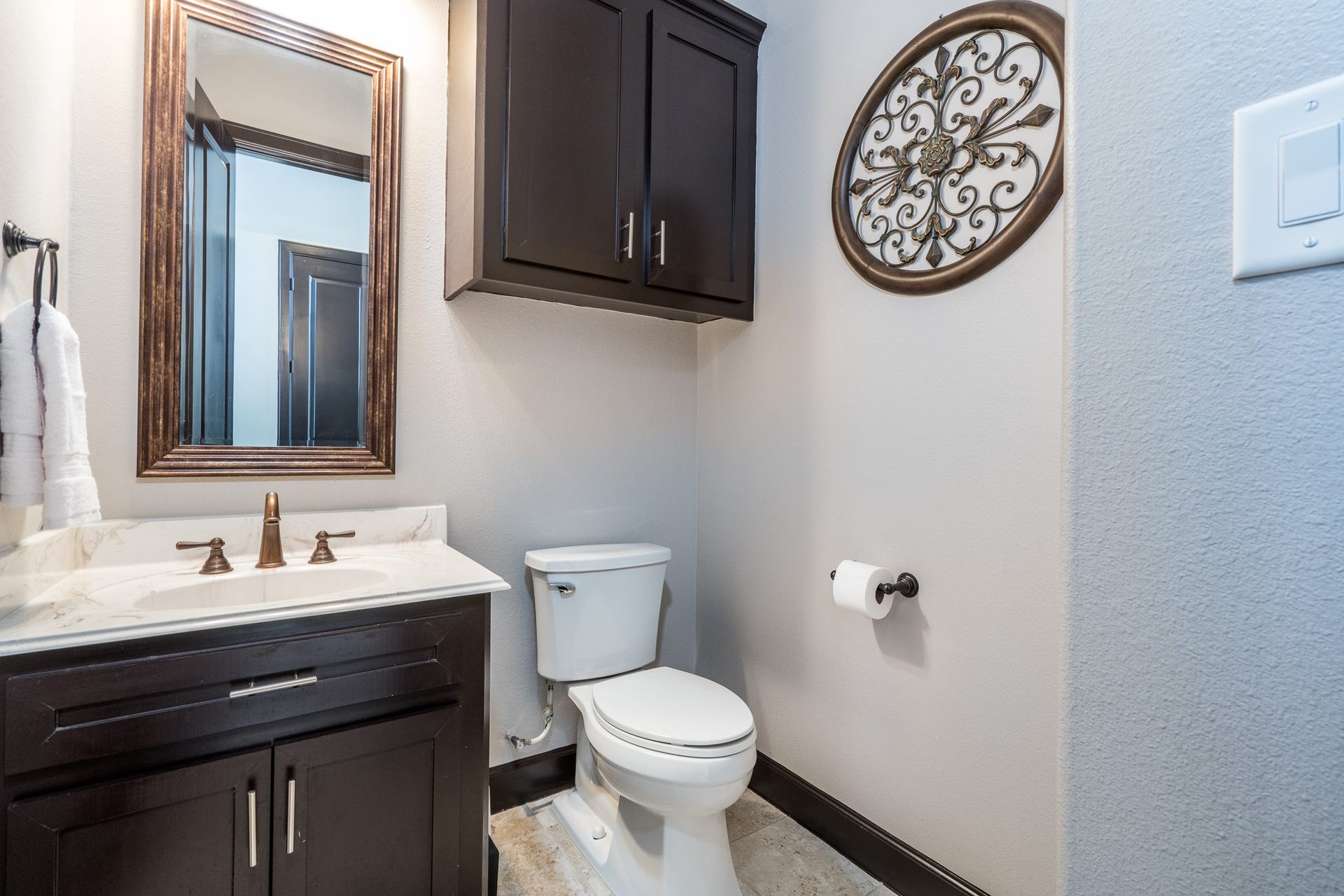Powder bath downstairs is convenient for guests when entertaining.