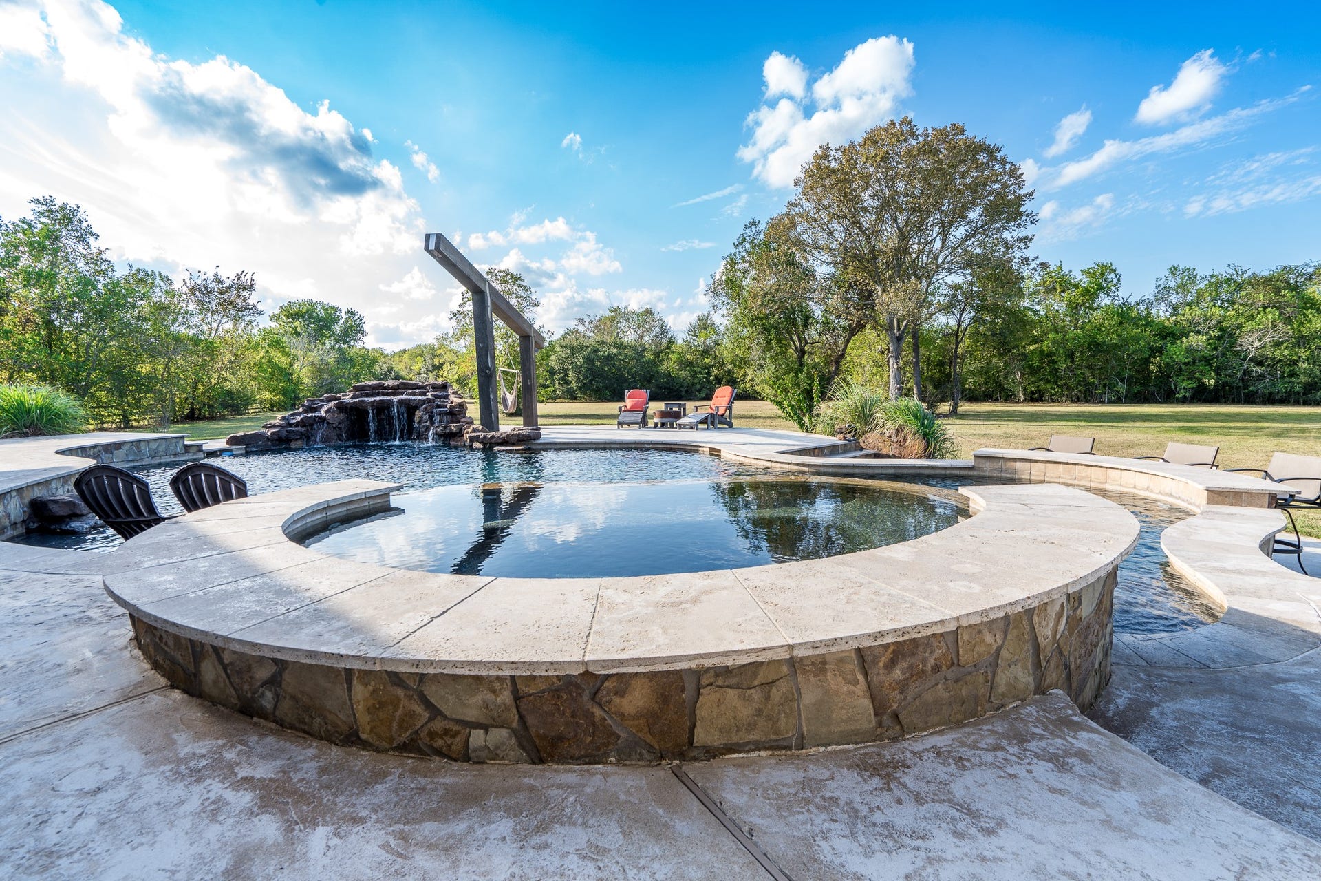 The oversized spa is made for year-round entertaining with tranquil views.