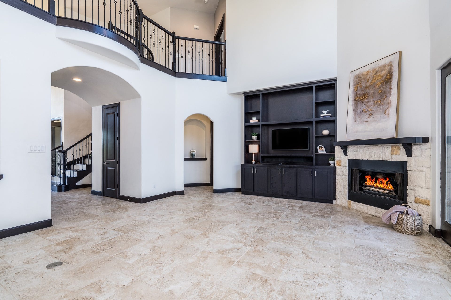 Inviting living area has soaring 23ft ceiling and tons of nautral light.