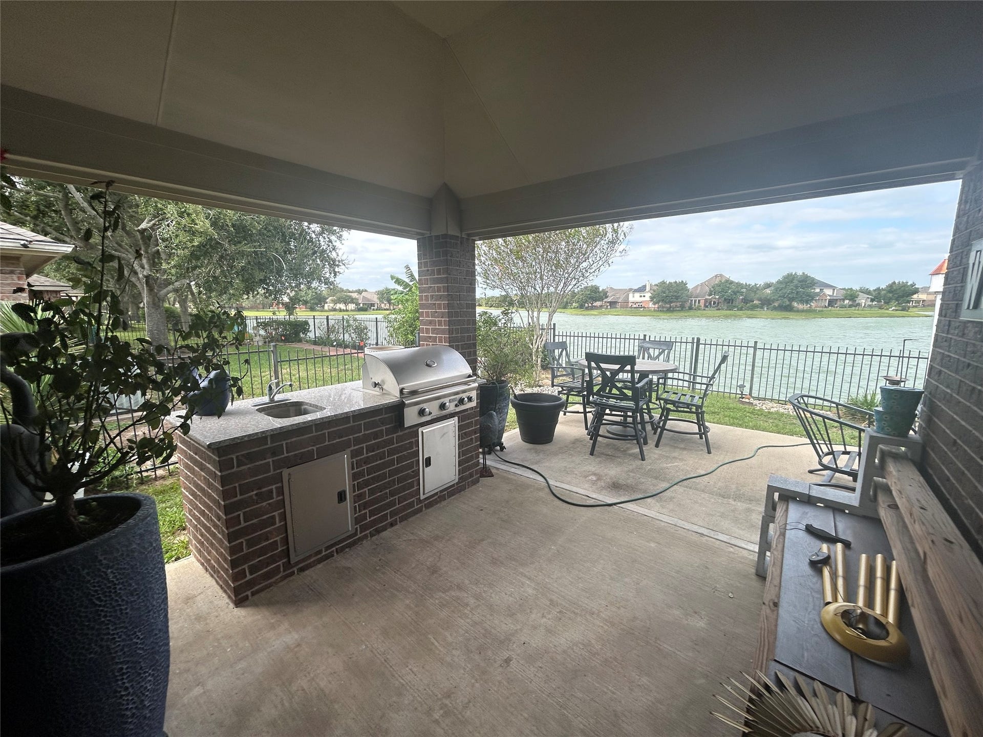 26118 Travis Brook Drive, Richmond, TX 77406 Covered patio equipped with gas grill & sink