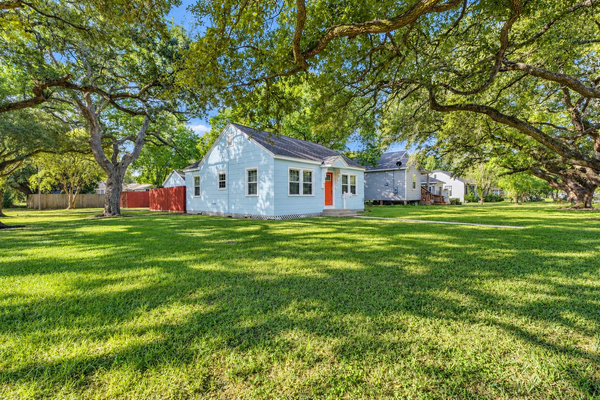 801 18th Avenue N, Texas City, TX 77590 This charming blue house offers more than an inviting exterior! With a spacious lawn, mature trees, and a classic design, the property provides outdoor enjoyment alongside the comfort of a 2-bedroom home.