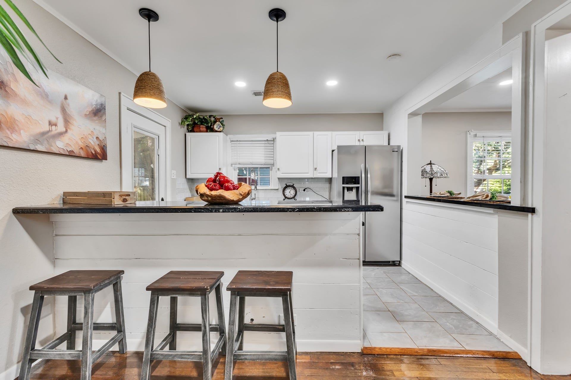801 18th Avenue N, Texas City, TX 77590 Small details can make a big difference in everyday living! This breakfast bar adds casual dining space and a natural gathering spot, giving the kitchen extra functionality while maintaining an open feel.
