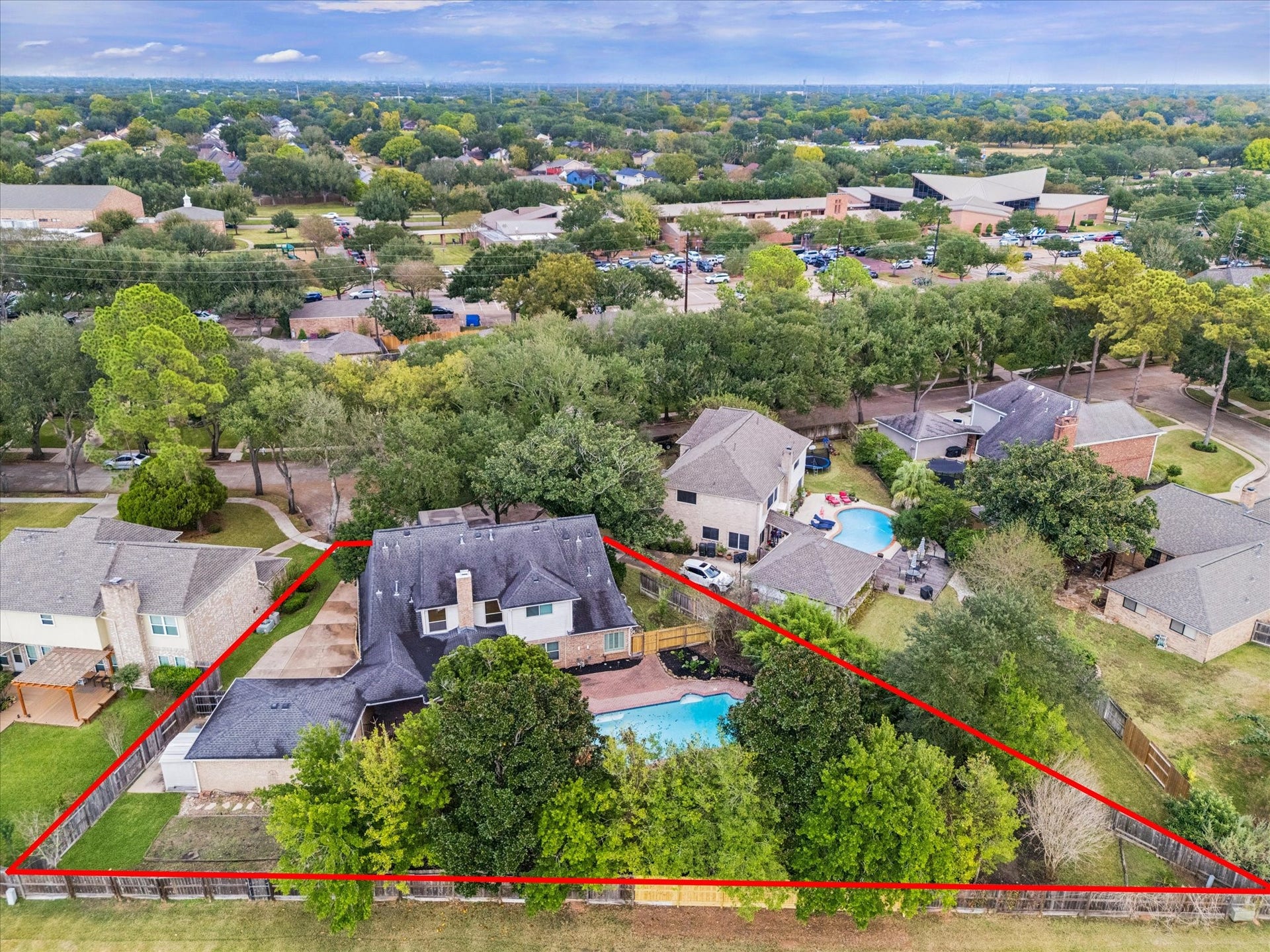 2526 STEPHENS GRANT DRIVE, Sugar Land, TX 77479 Set within a friendly, established neighborhood, this appealing residence boasts a beautifully maintained backyard, offering a private oasis with a sparkling in-ground pool perfect for relaxation and social gatherings.