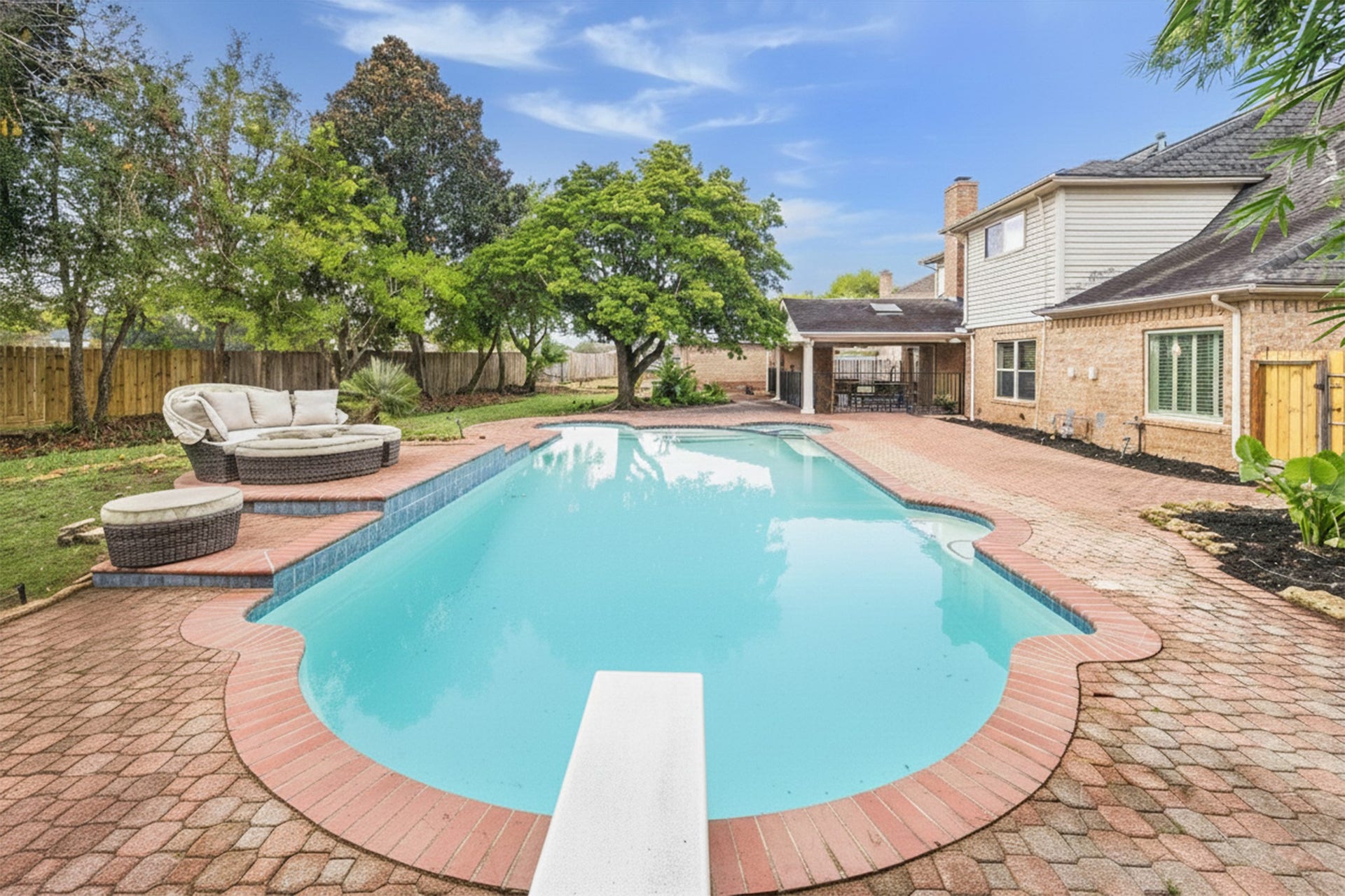 2526 STEPHENS GRANT DRIVE, Sugar Land, TX 77479 This superb pool features a clean diving ledge for added recreation, surrounded by a generous brick patio and multiple seating areas for year-round enjoyment.