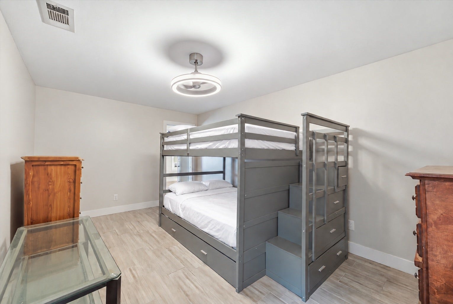 1718 Laurel Springs Lane, Kingwood, TX 77339 This versatile flex room is accessible from both the second primary suite and the front hallway, offering flexibility for a home office, hobby room, gaming room, or private sitting area.