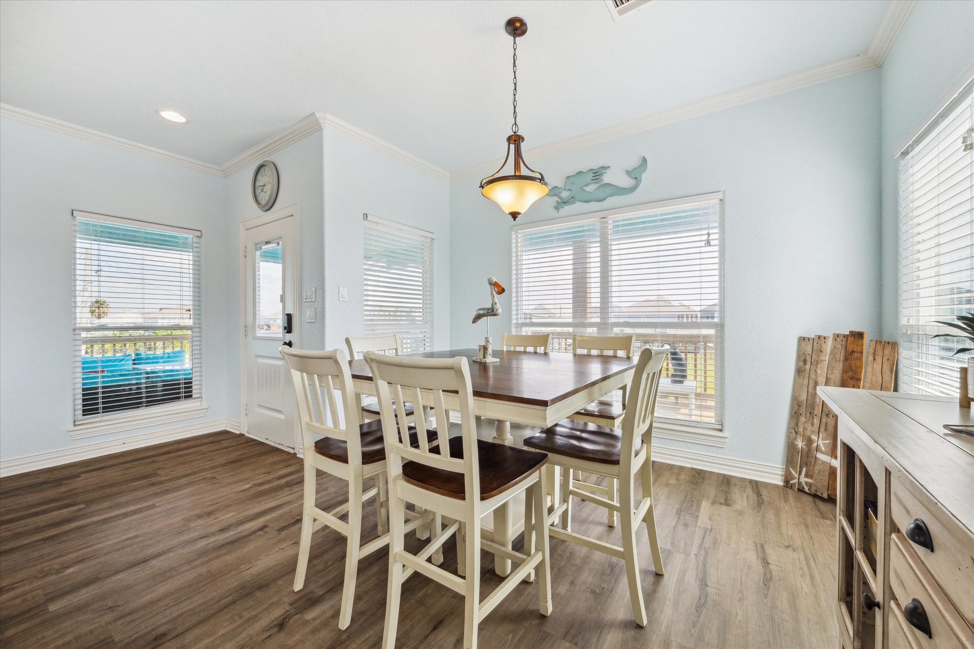 923 Tidelands Drive, Crystal Beach, TX 77650 Off the family room, you'll find the dining room, a bright and airy space surrounded by windows that let in an abundance of natural light. It's truly one of the best rooms in the house, offering a perfect setting for meals gatherings, and late night game nights while enjoying scenic views!