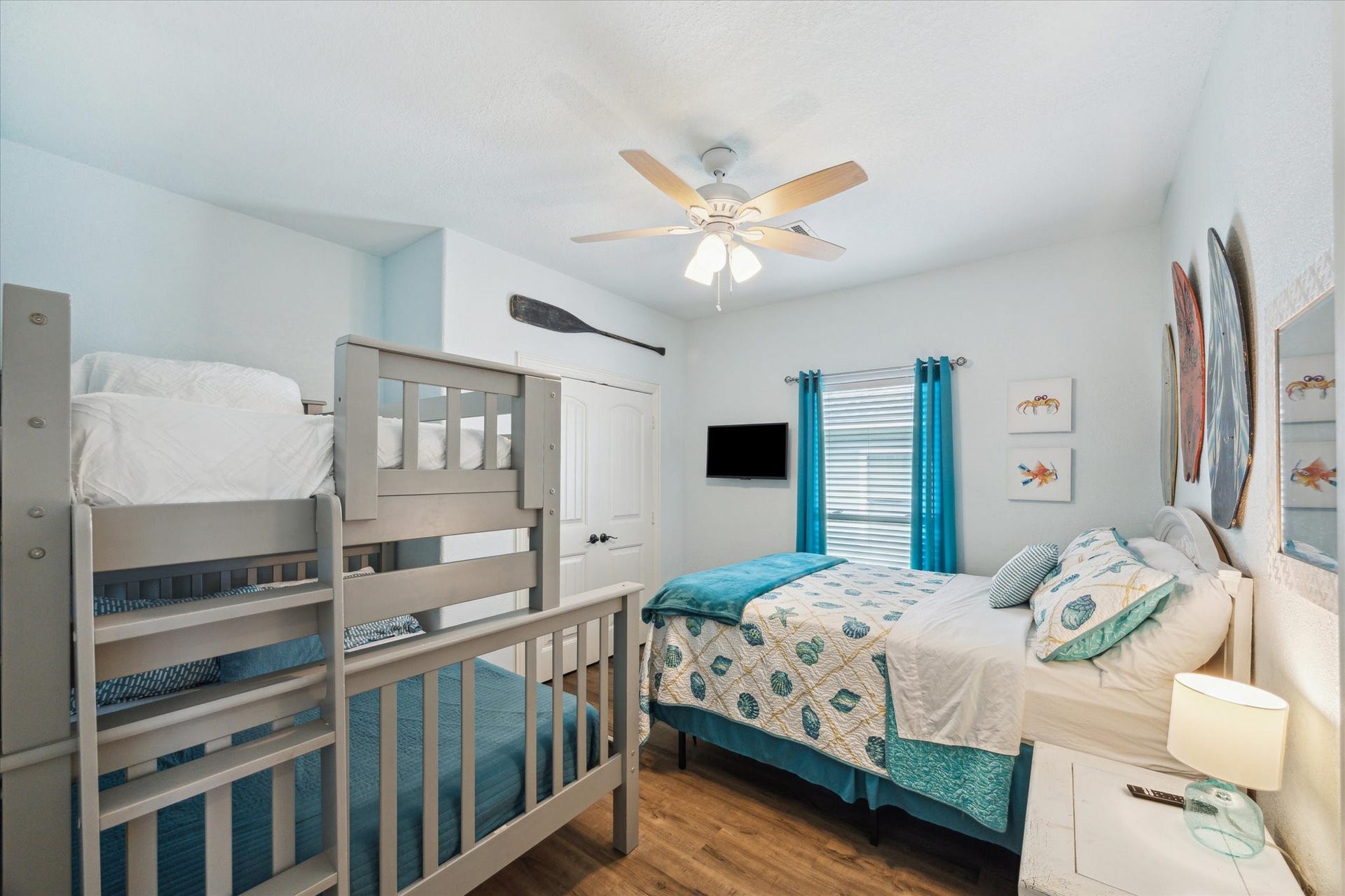 923 Tidelands Drive, Crystal Beach, TX 77650 Large guest room perfect for hosting visitors or as "the kids' room!" This spacious area easily accommodates a queen-size bed and large bunk beds, making it ideal for family or friends.
