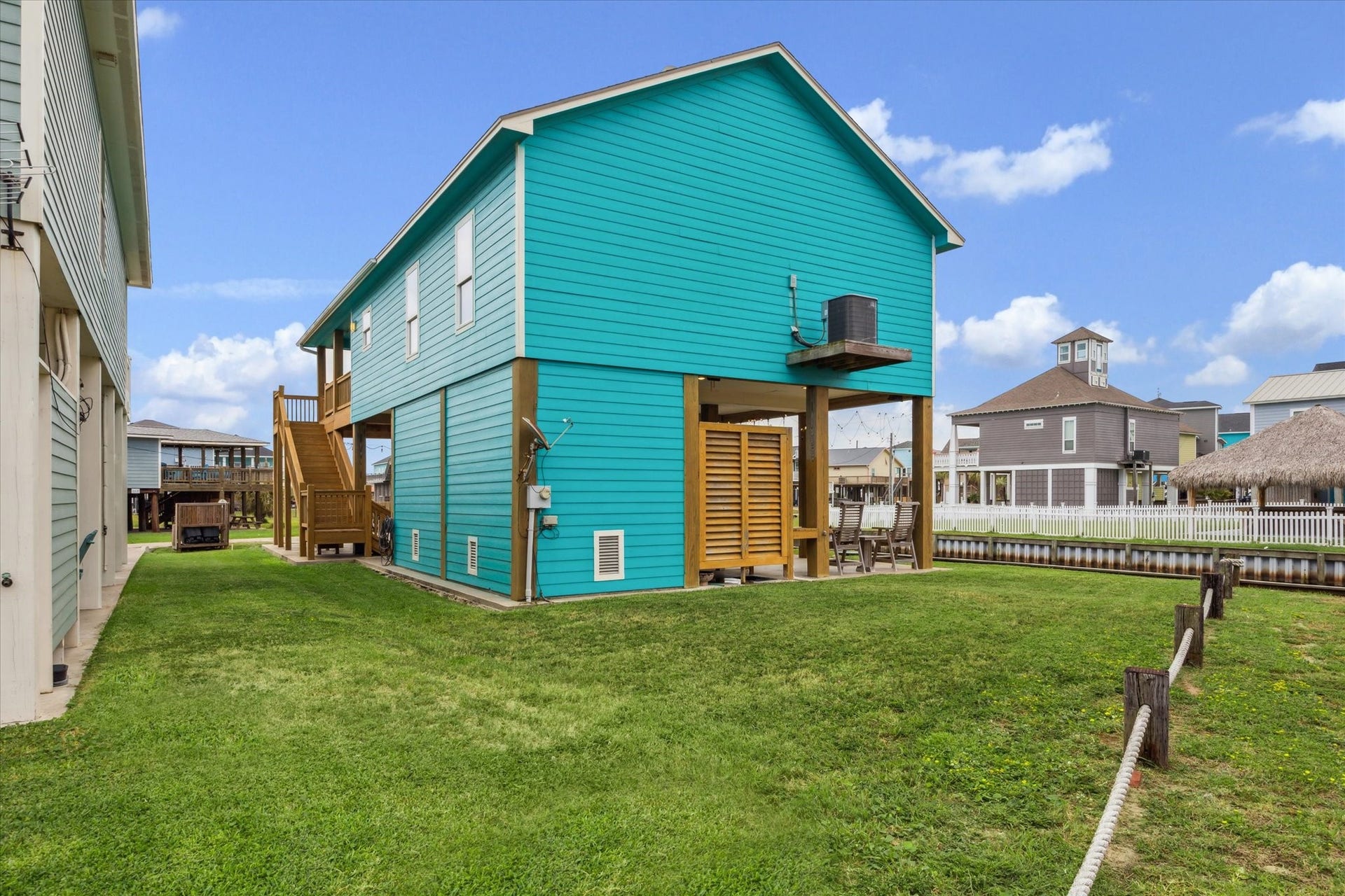 923 Tidelands Drive, Crystal Beach, TX 77650 NEW AC unit - September 2025. View of the side yard and backyard.