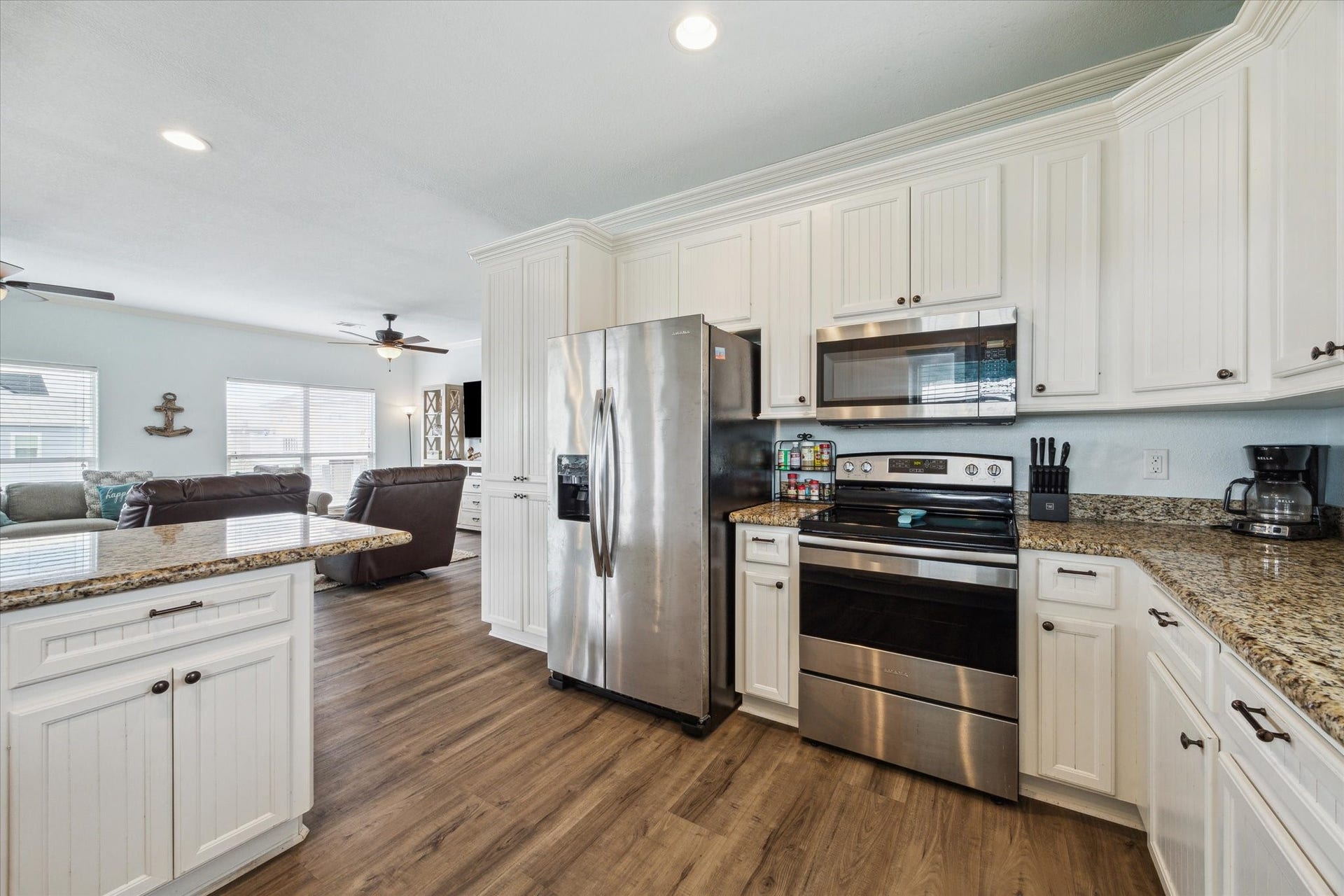 923 Tidelands Drive, Crystal Beach, TX 77650 NEW $1500 Frigidaire refrigerator now at property. Spacious kitchen featuring stainless steel appliances, all the essential kitchenware, and granite countertops.