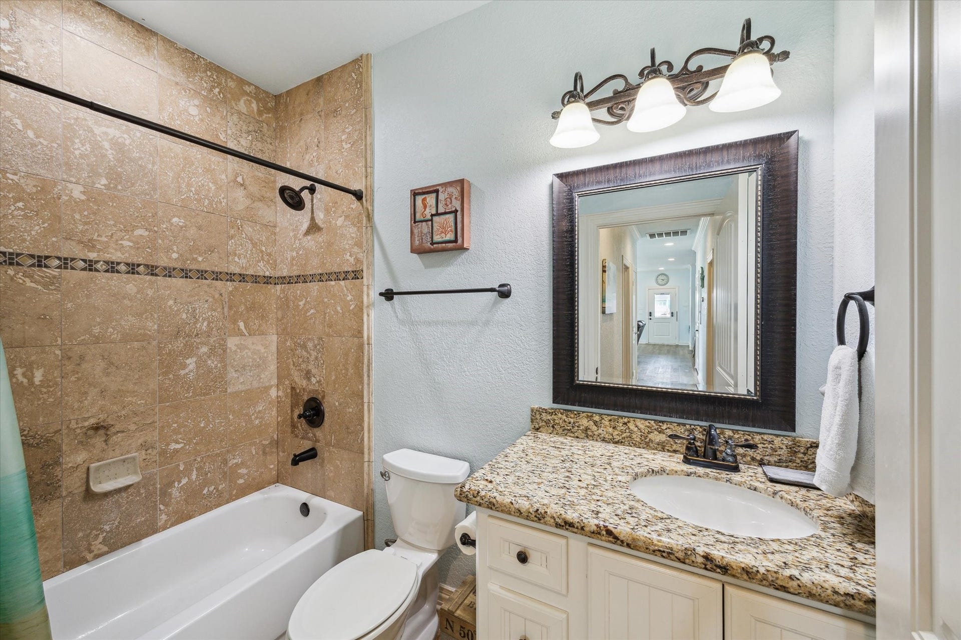923 Tidelands Drive, Crystal Beach, TX 77650 Secondary bathroom with a tub / shower combo.