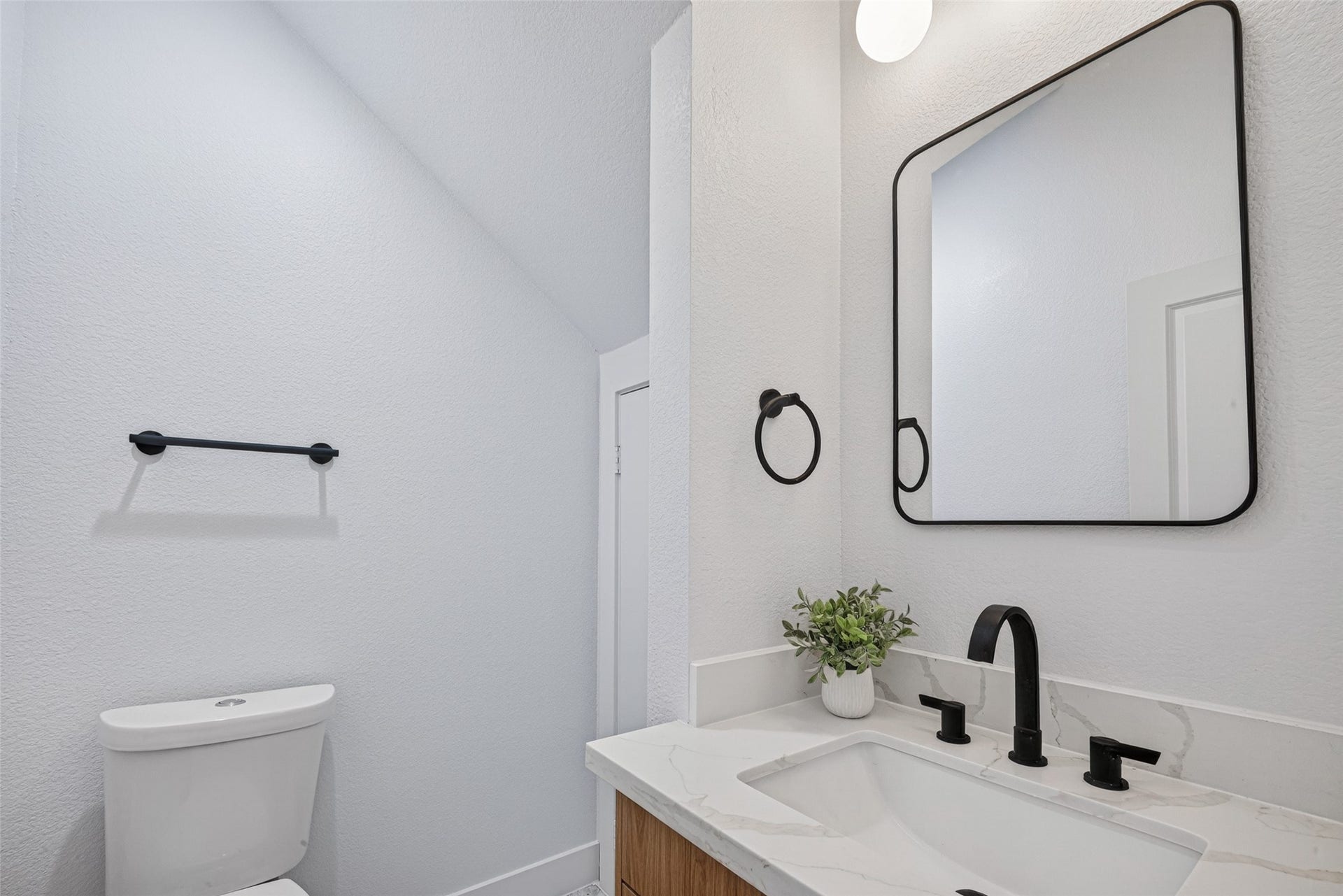 7840 Nashville Unit A/B Street, Houston, TX 77028 Half bath with marble flooring