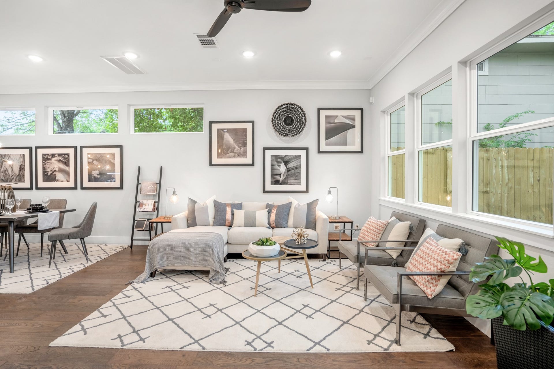 314 N Stiles Street, Houston, TX 77011 The living room offers a cozy retreat with its plush furnishings, warm color palette, and abundant natural light. Photos are of previous model home.