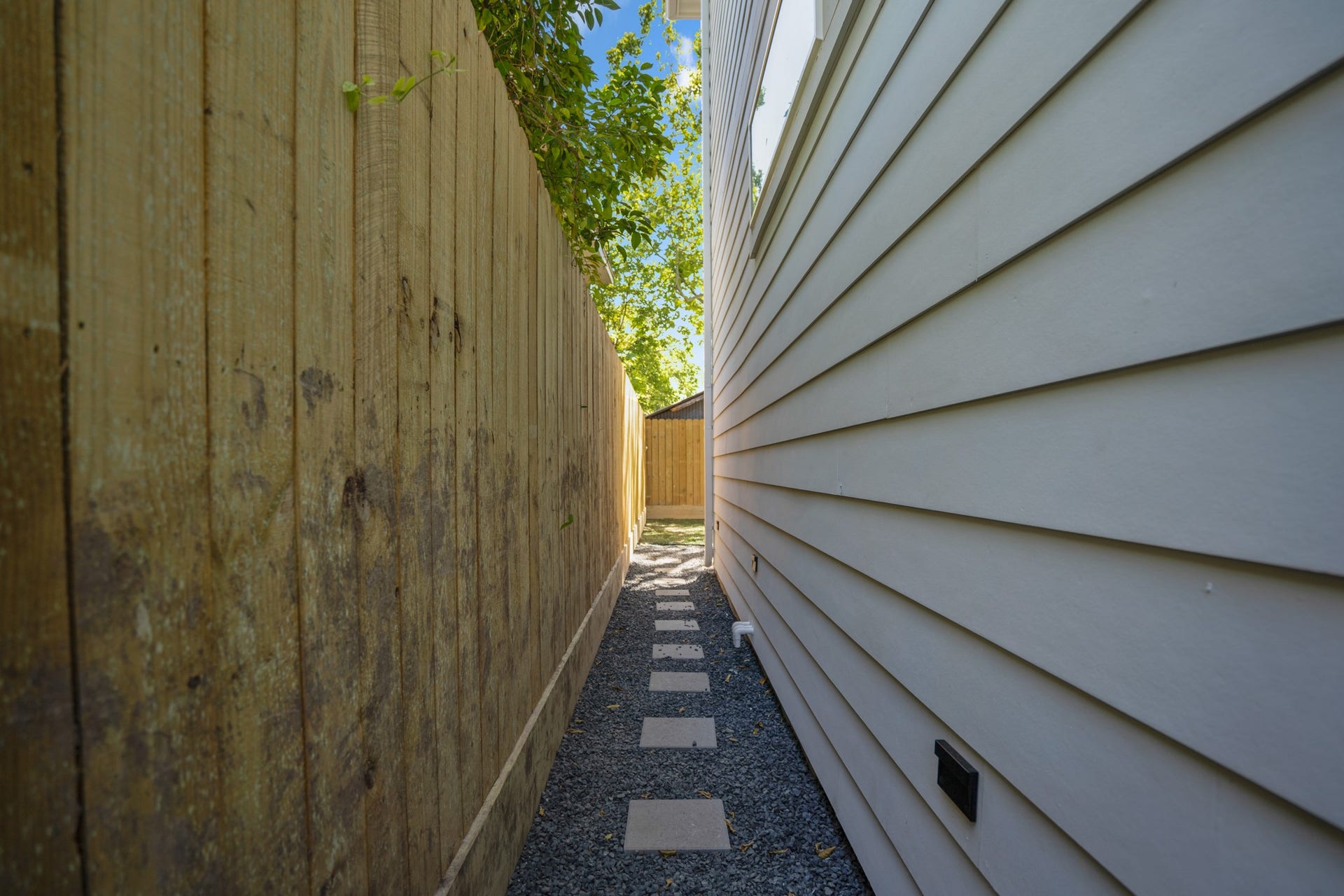 314 N Stiles Street, Houston, TX 77011 Whether it's accessing the backyard, garage, or front entrance, this well-defined pathway ensures safe and efficient navigation around the home. Photos are of previous model home.