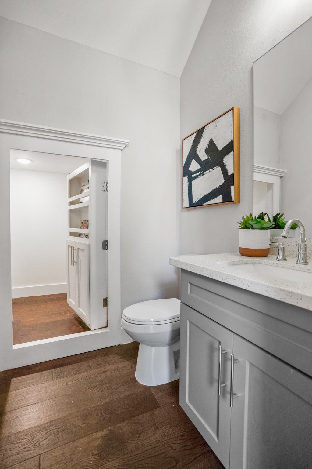 314 N Stiles Street, Houston, TX 77011 Tucked away behind a discreet panel lies a hidden storage closet within the half bath, providing a clever solution for stowing away essentials while maintaining a clean and uncluttered space. Photos are of previous model home.