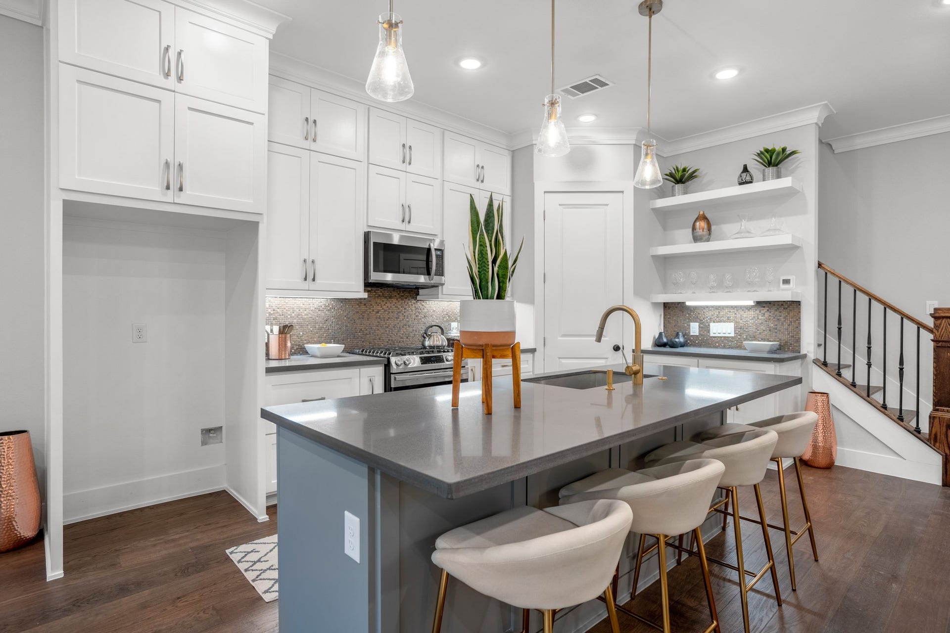 314 N Stiles Street, Houston, TX 77011 The kitchen island commands attention with its sleek design and ample workspace, making it the culinary centerpiece of the home. Photos are of previous model home.