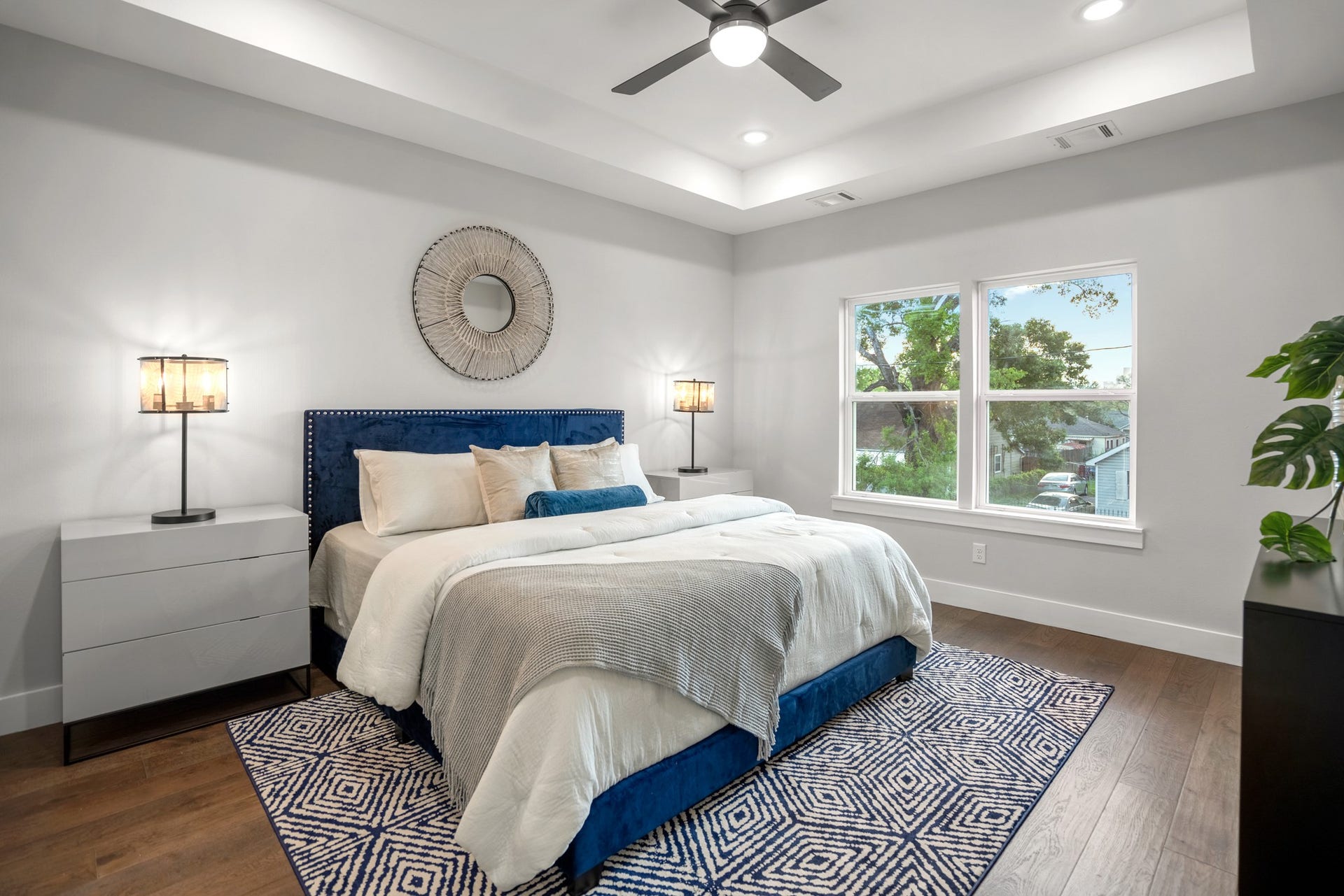 314 N Stiles Street, Houston, TX 77011 Master bedroom features a beautiful tray ceiling design as well as recessed LED lighting along 6 inch plank floors. Photos are of previous model home.