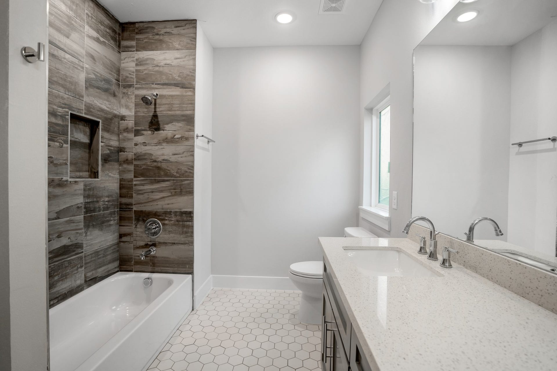 314 N Stiles Street, Houston, TX 77011 With its clean lines, contemporary finishes, and ample counter space, this chic sanctuary offers a refreshing escape for guests or family members alike. Photos are of previous model home.