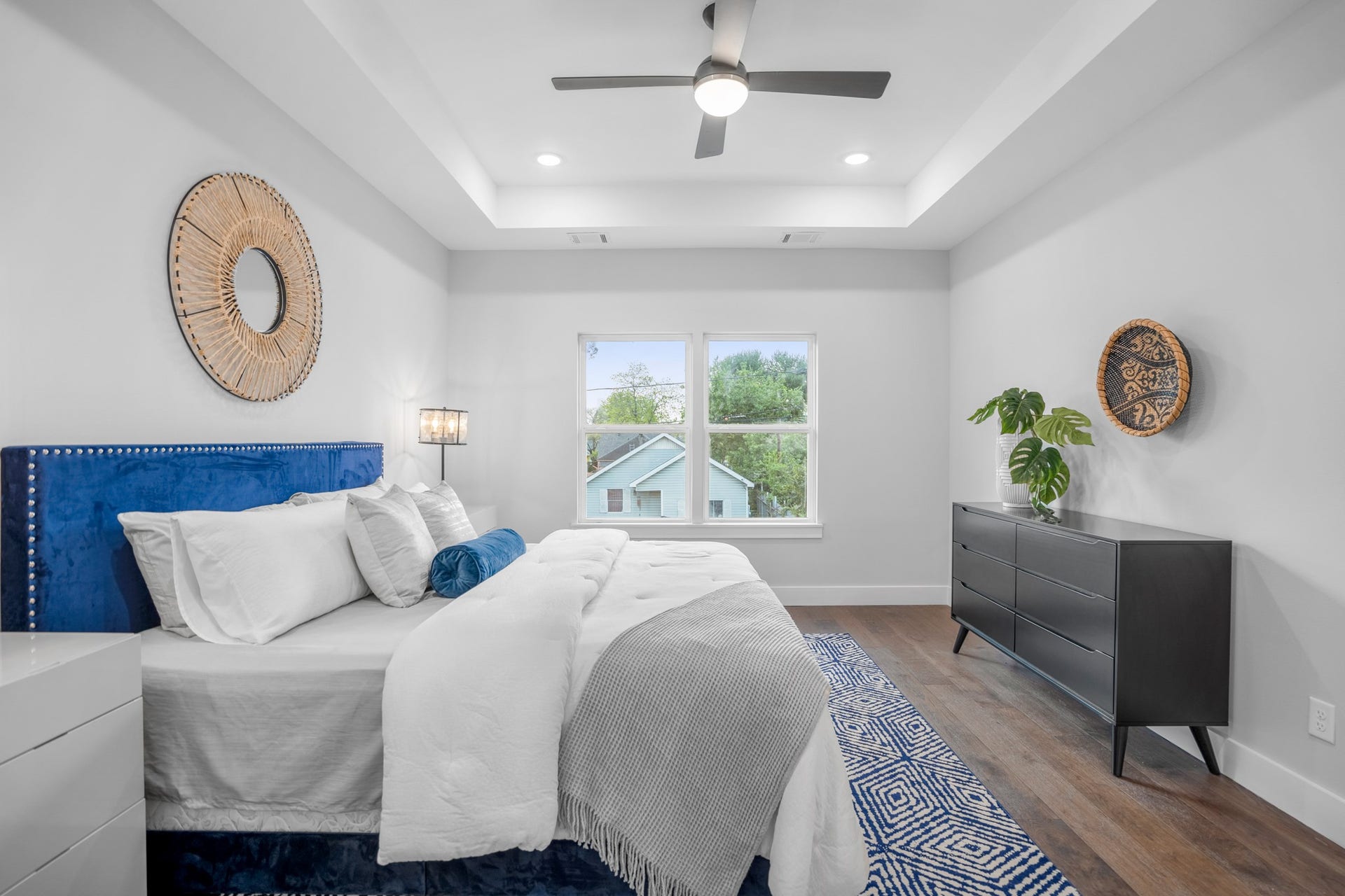 314 N Stiles Street, Houston, TX 77011 The master bedroom is a tranquil retreat, offering a serene oasis for relaxation and rejuvenation. Photos are of previous model home.