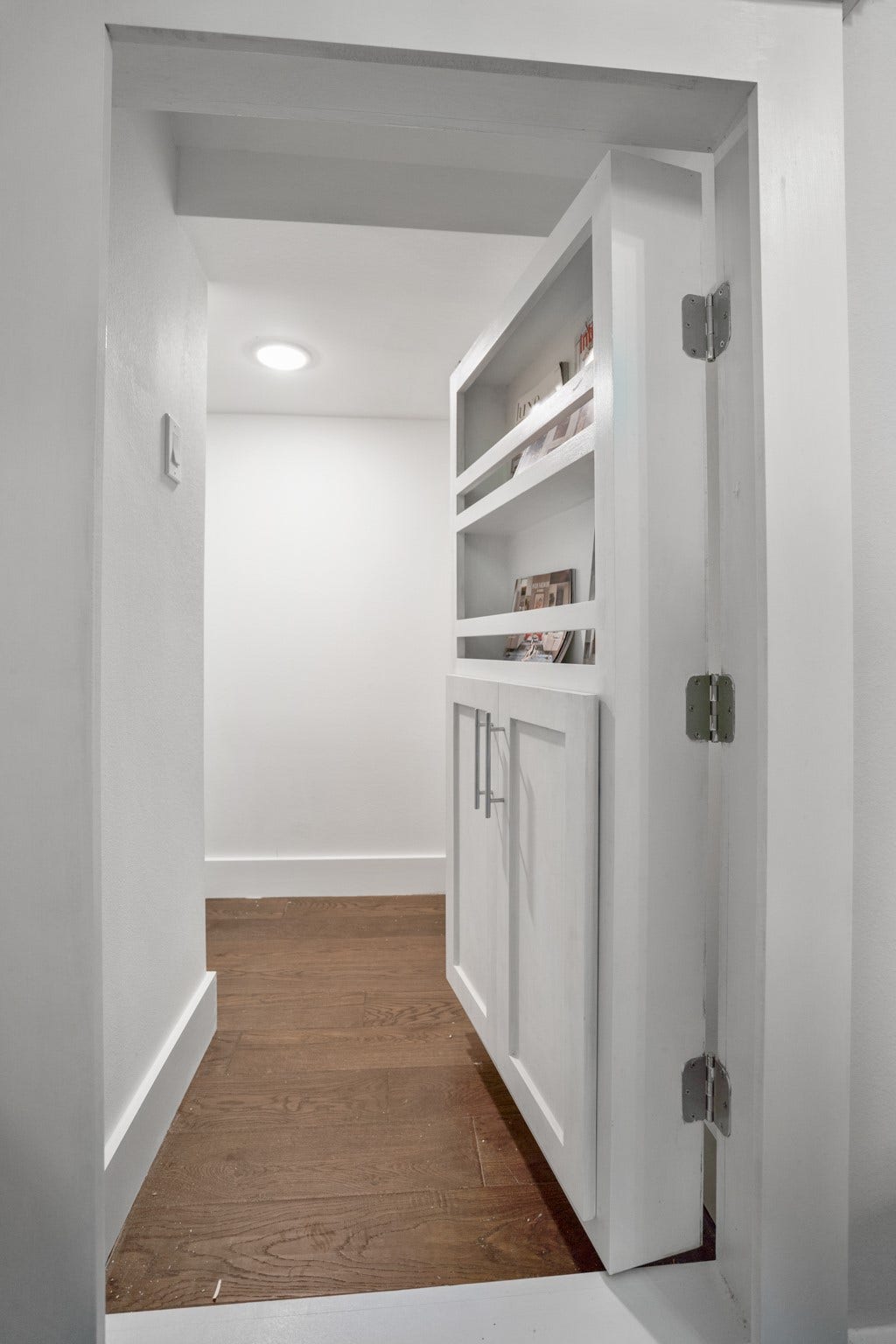 314 N Stiles Street, Houston, TX 77011 With its seamless integration into the design, this concealed storage adds both functionality and elegance to the powder room. Photos are of previous model home.