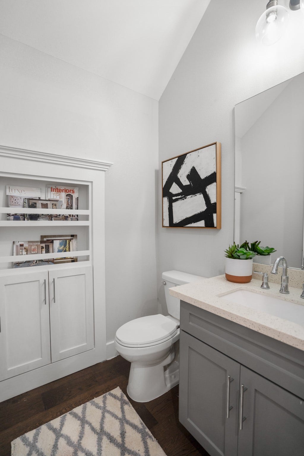 314 N Stiles Street, Houston, TX 77011 The half bath is a stylish sanctuary, featuring modern fixtures and chic design elements. Photos are of previous model home.