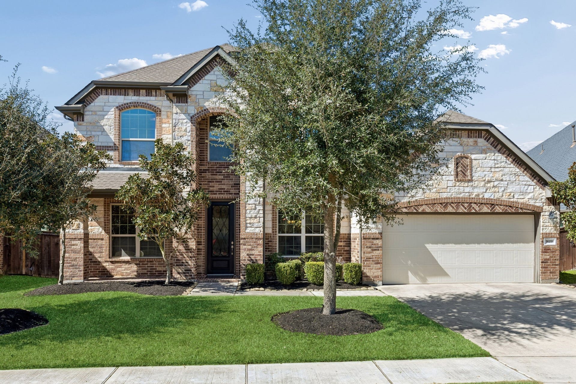 1619 Dove Ridge Drive, Katy, TX 77493 Welcome to 1619 Dove Ridge Drive. This beautiful residence in Cane Island offers exceptional curb appeal with professional landscaping. The two-story design features a striking elevation and a spacious attached garage.