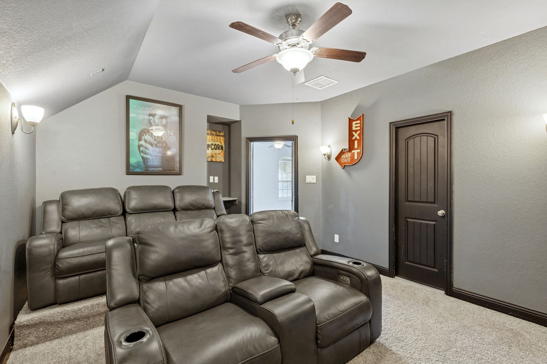 1619 Dove Ridge Drive, Katy, TX 77493 A true media retreat designed for comfort, featuring plush reclining seating, elevated sightlines, and a vaulted ceiling for an immersive movie-night experience. This dedicated space is perfect for game days, streaming marathons, or entertaining guests in style.