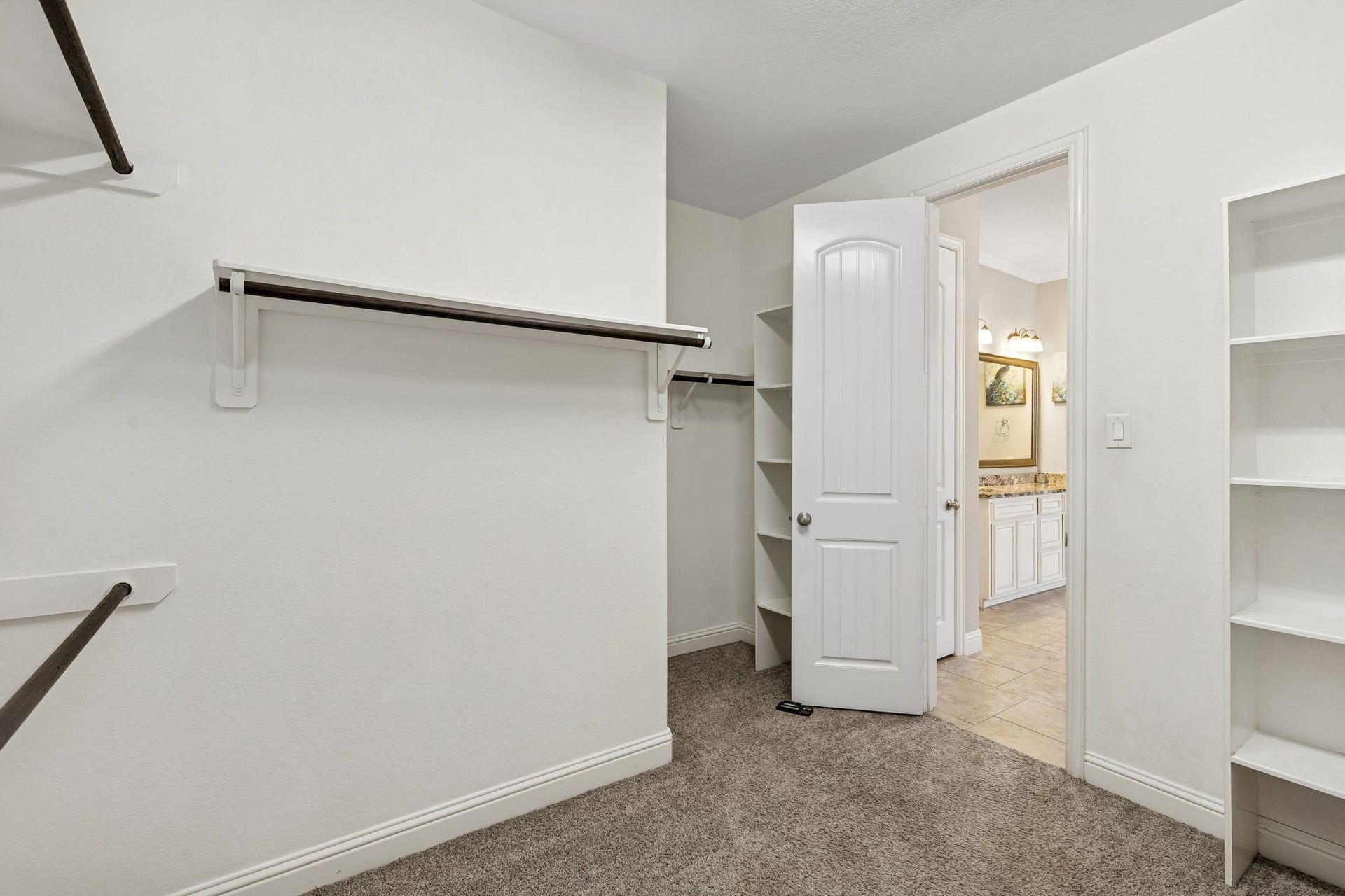 1619 Dove Ridge Drive, Katy, TX 77493 This massive primary walk-in closet offers extensive built-in shelving and hanging space to keep your wardrobe organized.