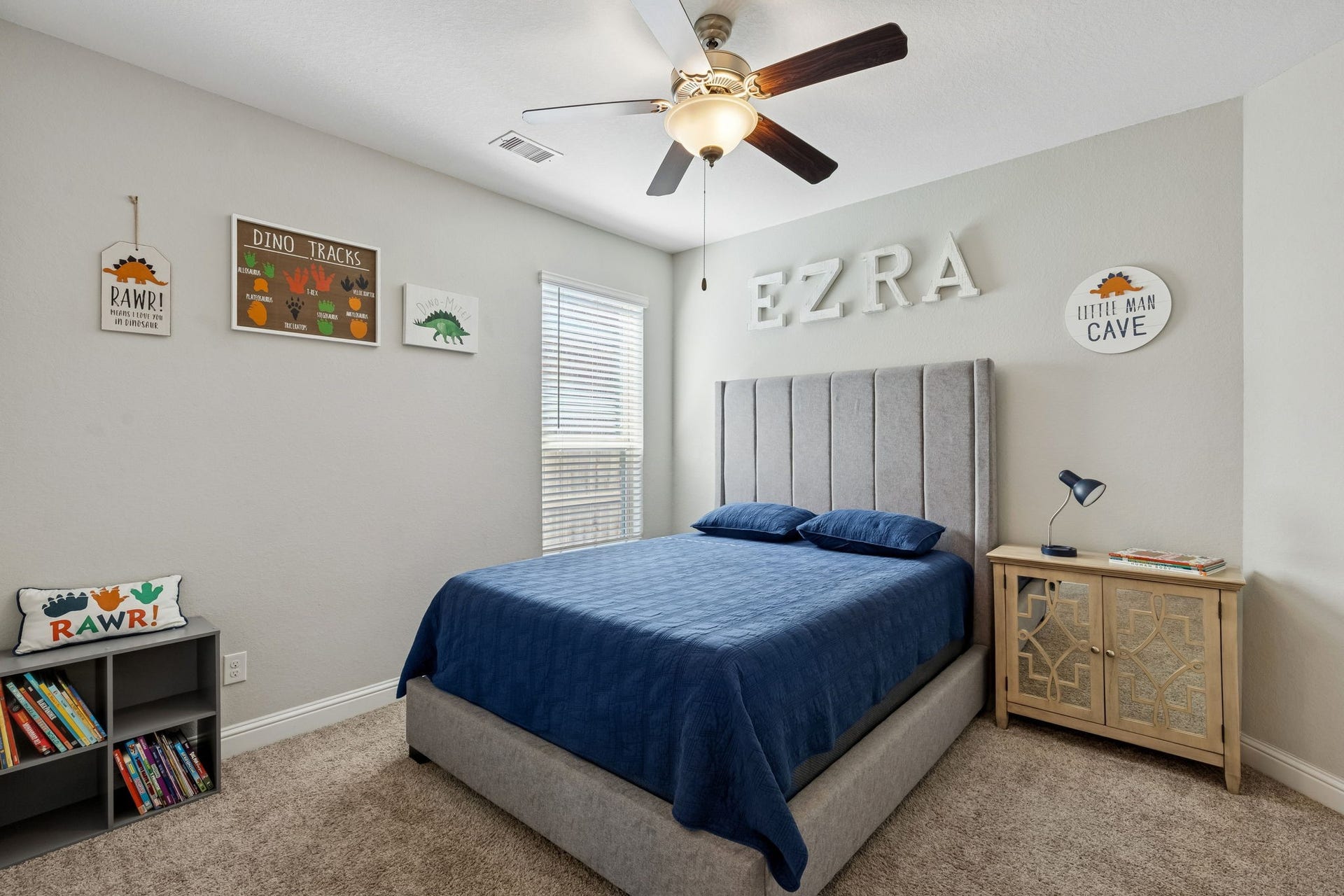 1619 Dove Ridge Drive, Katy, TX 77493 The first-floor secondary bedroom offers comfort and convenience, featuring a spacious layout and a large window that fills the room with beautiful natural light.