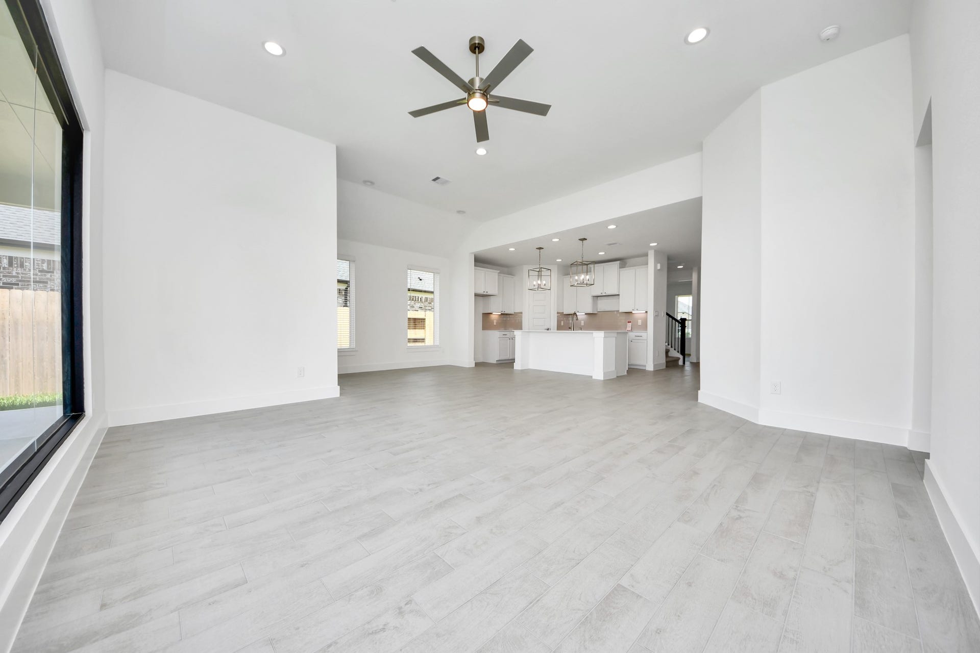 5906 Fox Peak Lane, Richmond, TX 77469 Take another glimpse into the heart of the home with this additional view of the family rooma sprawling space ready to accommodate all your gatherings. Sample photo of completed home with similar floor plan. Actual colors and selections may vary.