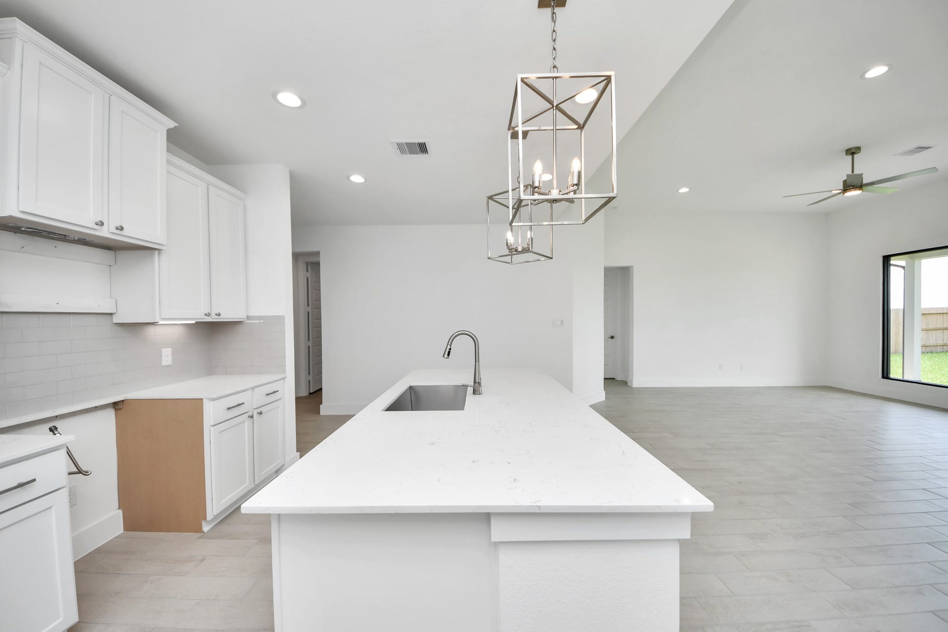 5906 Fox Peak Lane, Richmond, TX 77469 The extended counter area adds both practicality and style, making meal preparation a breeze. Every detail is thoughtfully designed to enhance the kitchen's functionality and aesthetic appeal. Sample photo of completed home with similar floor plan. Actual colors and selections may vary.