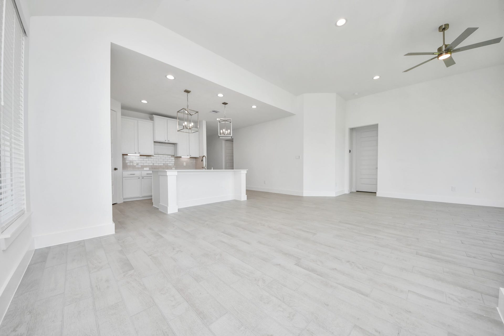 5906 Fox Peak Lane, Richmond, TX 77469 Discover another perspective of this stunning kitchen, generously appointed with an abundance of counter space. Sample photo of completed home with similar floor plan. Actual colors and selections may vary.