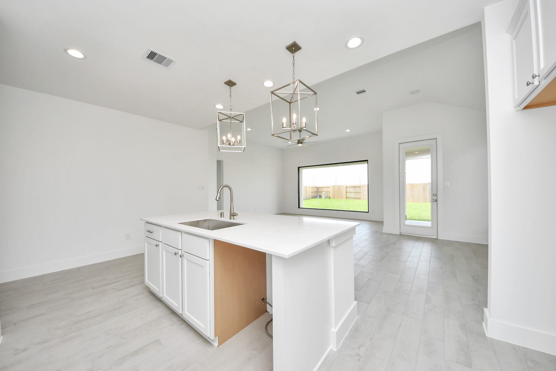 5906 Fox Peak Lane, Richmond, TX 77469 The open concept effortlessly connects the kitchen to the expansive family room, forming a perfect hub for gatherings. This seamless flow creates an inviting space where cooking and socializing come together harmoniously. Sample photo of completed home with similar floor plan. Actual colors and selections may vary.