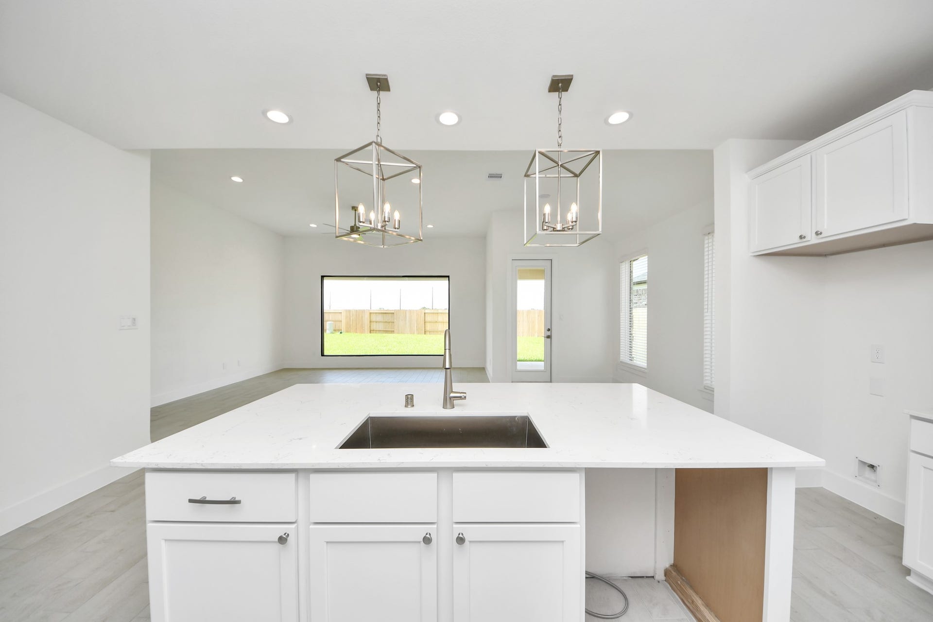 5906 Fox Peak Lane, Richmond, TX 77469 All of this overlooks your expansive family room, creating a perfect space for culinary delights and family gatherings. Sample photo of completed home with similar floor plan. Actual colors and selections may vary.