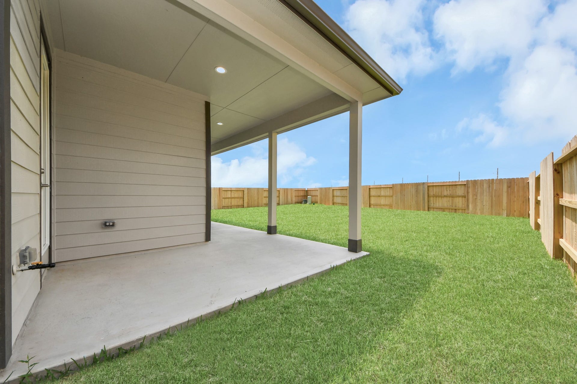 5906 Fox Peak Lane, Richmond, TX 77469 Experience outdoor living at its finest on this expansive covered patio, thoughtfully designed for BBQs and delightful outdoor dining. Sample photo of completed home with similar floor plan. Actual colors and selections may vary.
