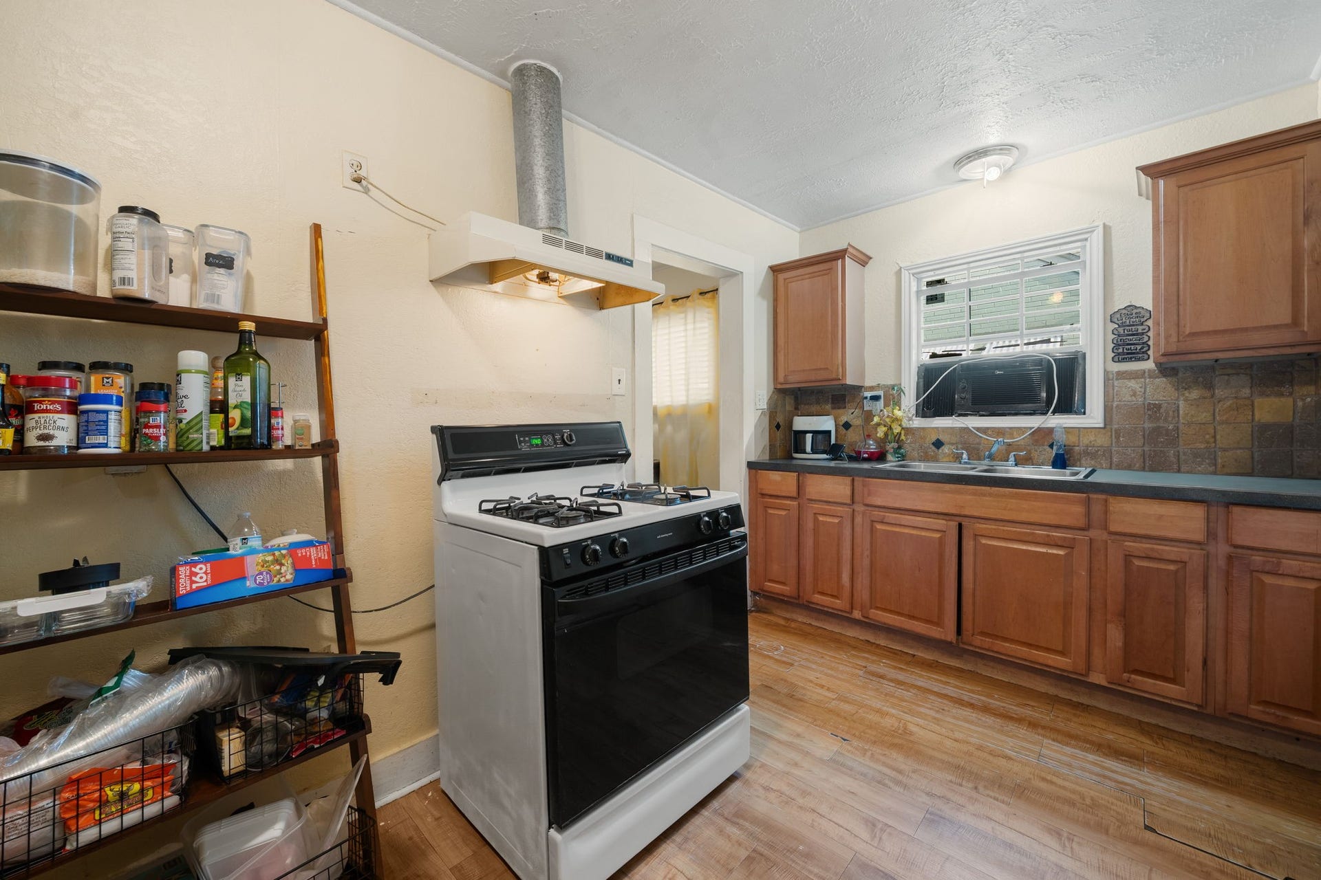 1821 Hatwell Street, Houston, TX 77023 Wood color cabinets, updated counters make this kitchen a chef's dream.