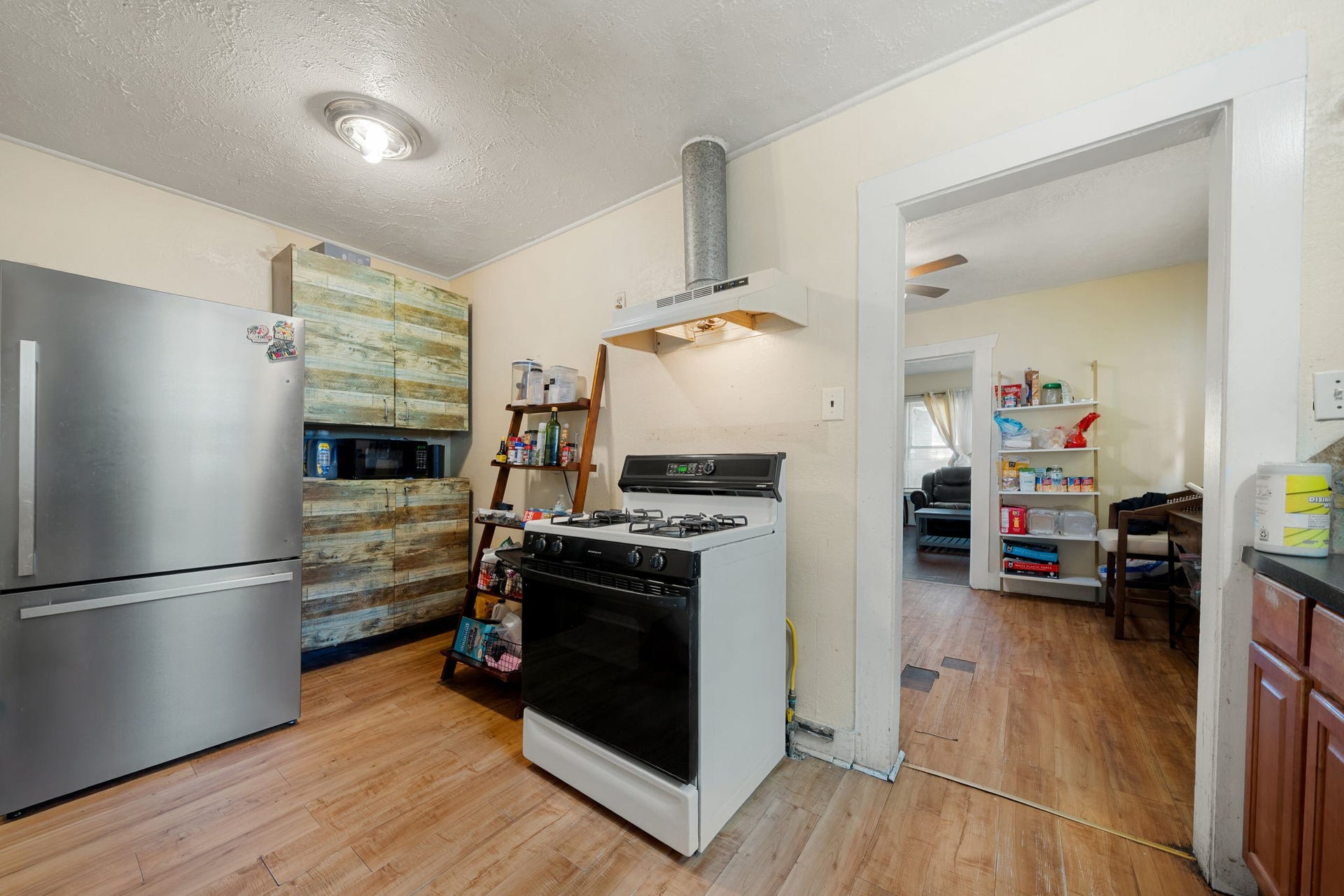 1821 Hatwell Street, Houston, TX 77023 Large kitchen with a gas stove and natural lighting and laminate flooring