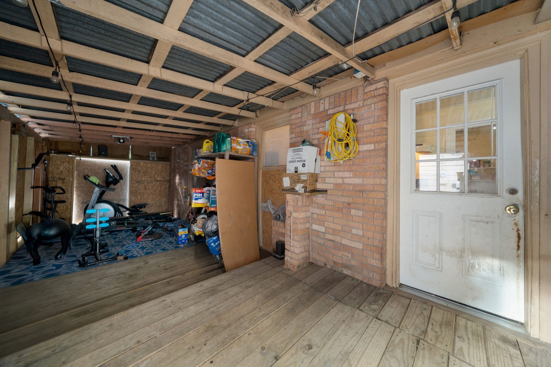 1821 Hatwell Street, Houston, TX 77023 Covered washer and dryer area with lots of storage.