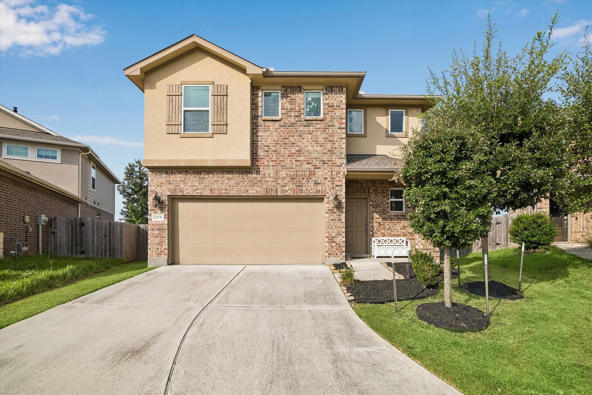 22537 Gran Sasso Drive, New Caney, TX 77357 Charming curb appeal. Nestled in the heart of the curve on a private street.