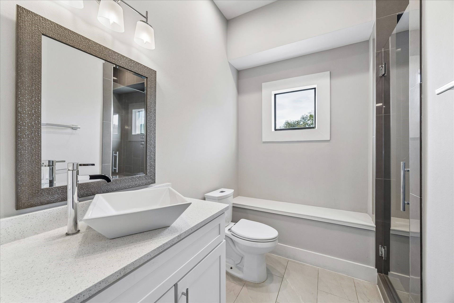 1959 Portsmouth Street, Houston, TX 77098 First secondary bathroom has a
walk-in shower with glass door that
was re-tiled by the current owners.