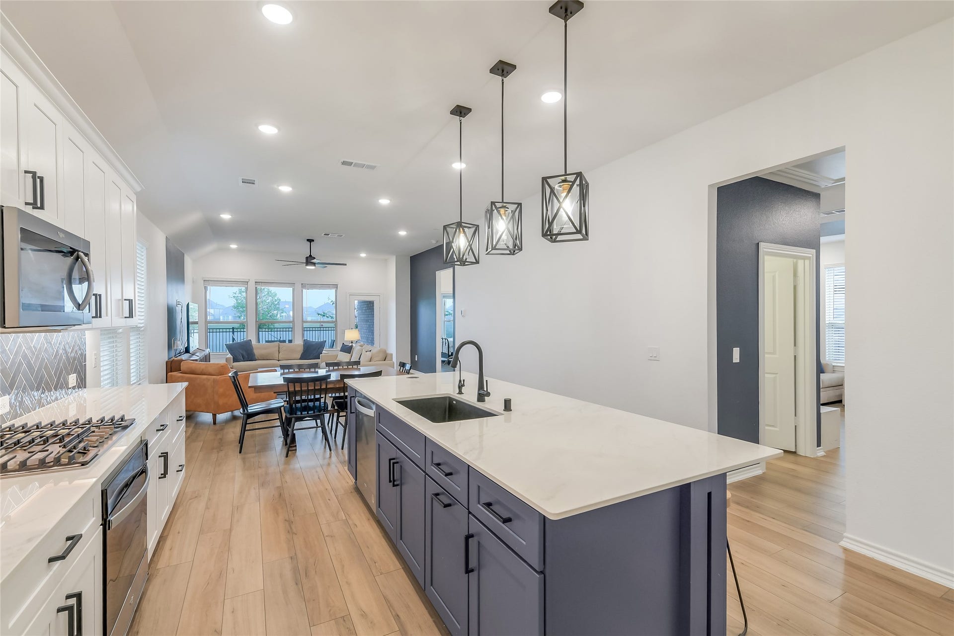 The heart of the home was designed for connectionan expansive kitchen and oversized island open effortlessly to the dining and living spaces, creating the perfect setting for everyday gatherings and entertaining.
