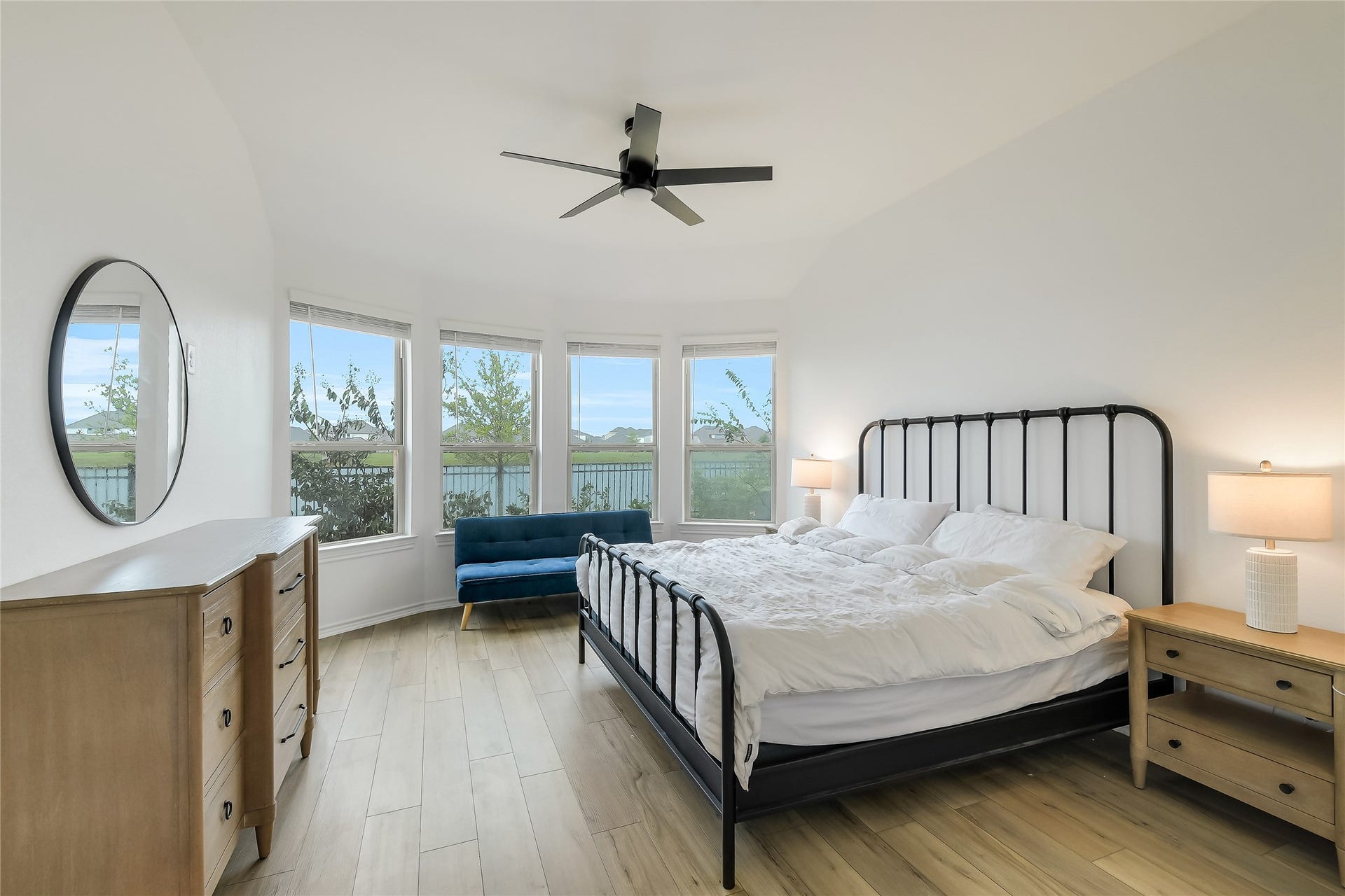 Wake up to peaceful lake views from your private primary retreat. Generous windows bring the waterfront setting indoors, creating a serene place to begin the morning, unwind at the end of the day, and enjoy the lifestyle that makes this home special.