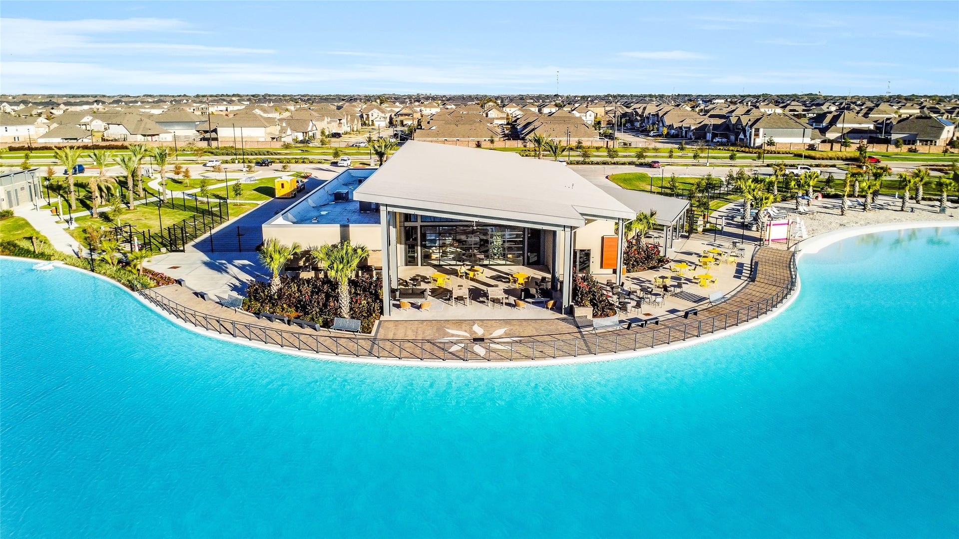 A sweeping aerial view highlights
the lagoon and amenity spaces,
emphasizing the communitys
resort-style atmosphere.