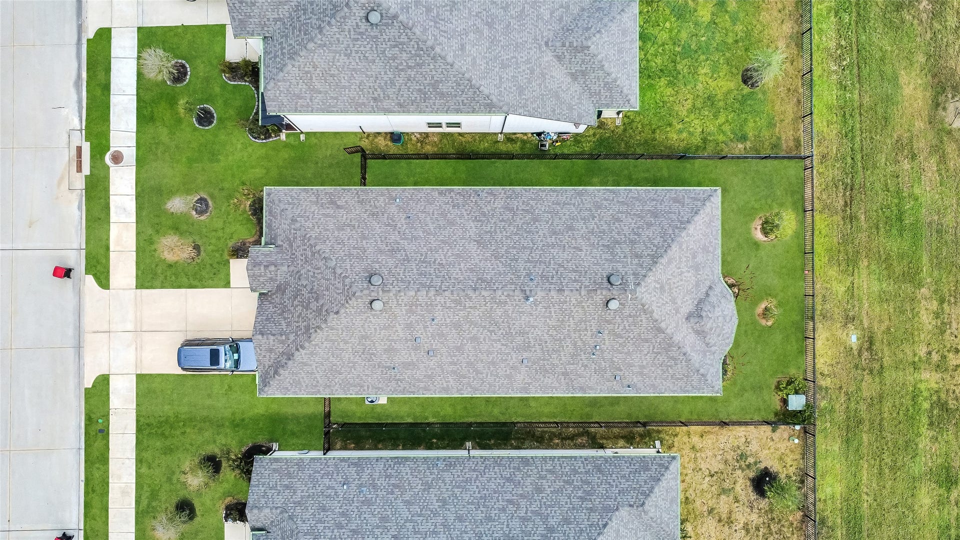 Aerial perspective showcases the home and lot, offering a clear look at the propertys footprint and outdoor space while highlighting the setting that makes this home so special.