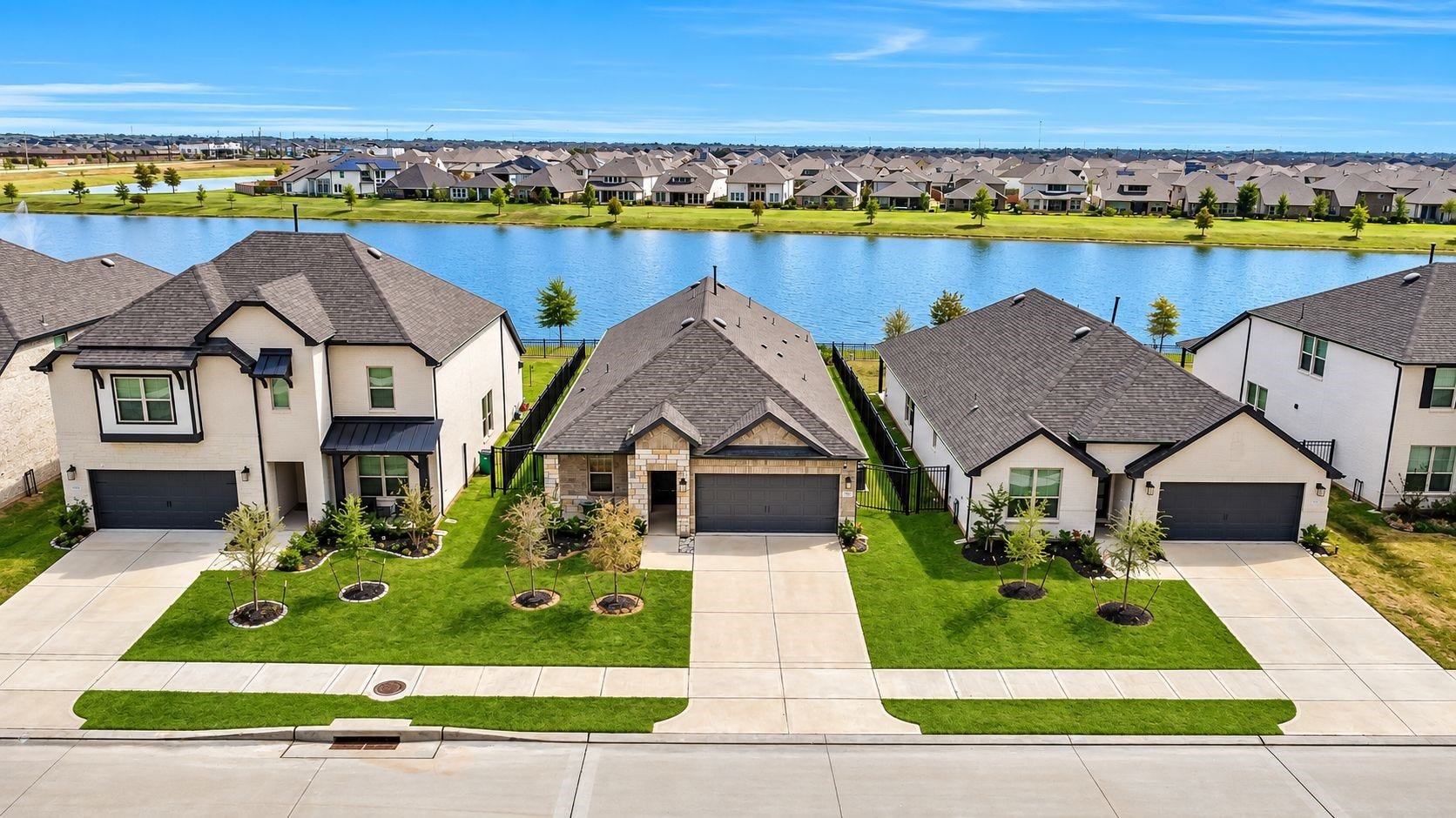 The aerial view tells the full storyan established residential setting paired with a beautiful lake just beyond the homes, offering the rare opportunity to enjoy water views as part of everyday life.